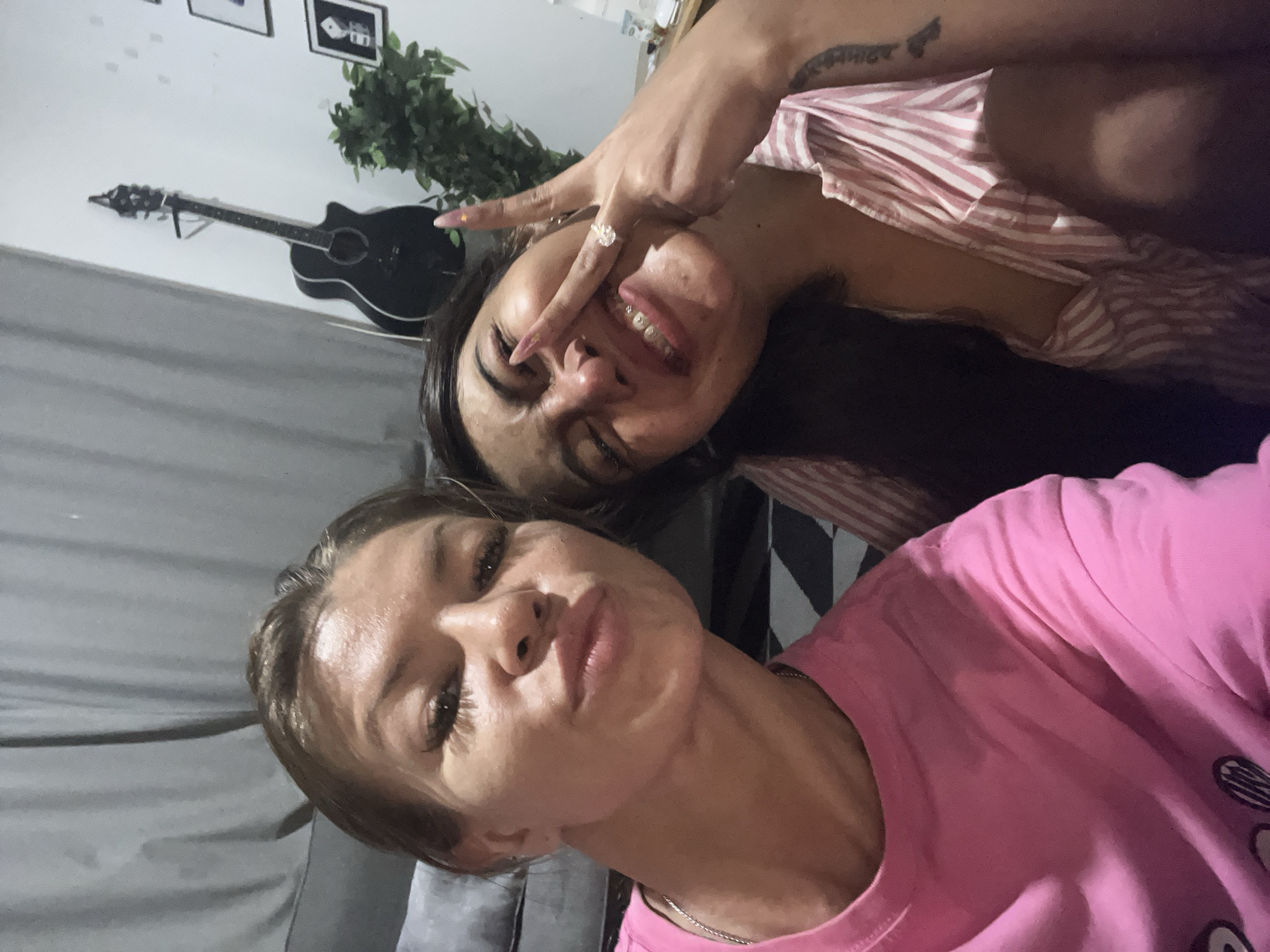 Two women pose for selfie in Kuta, Indonesia