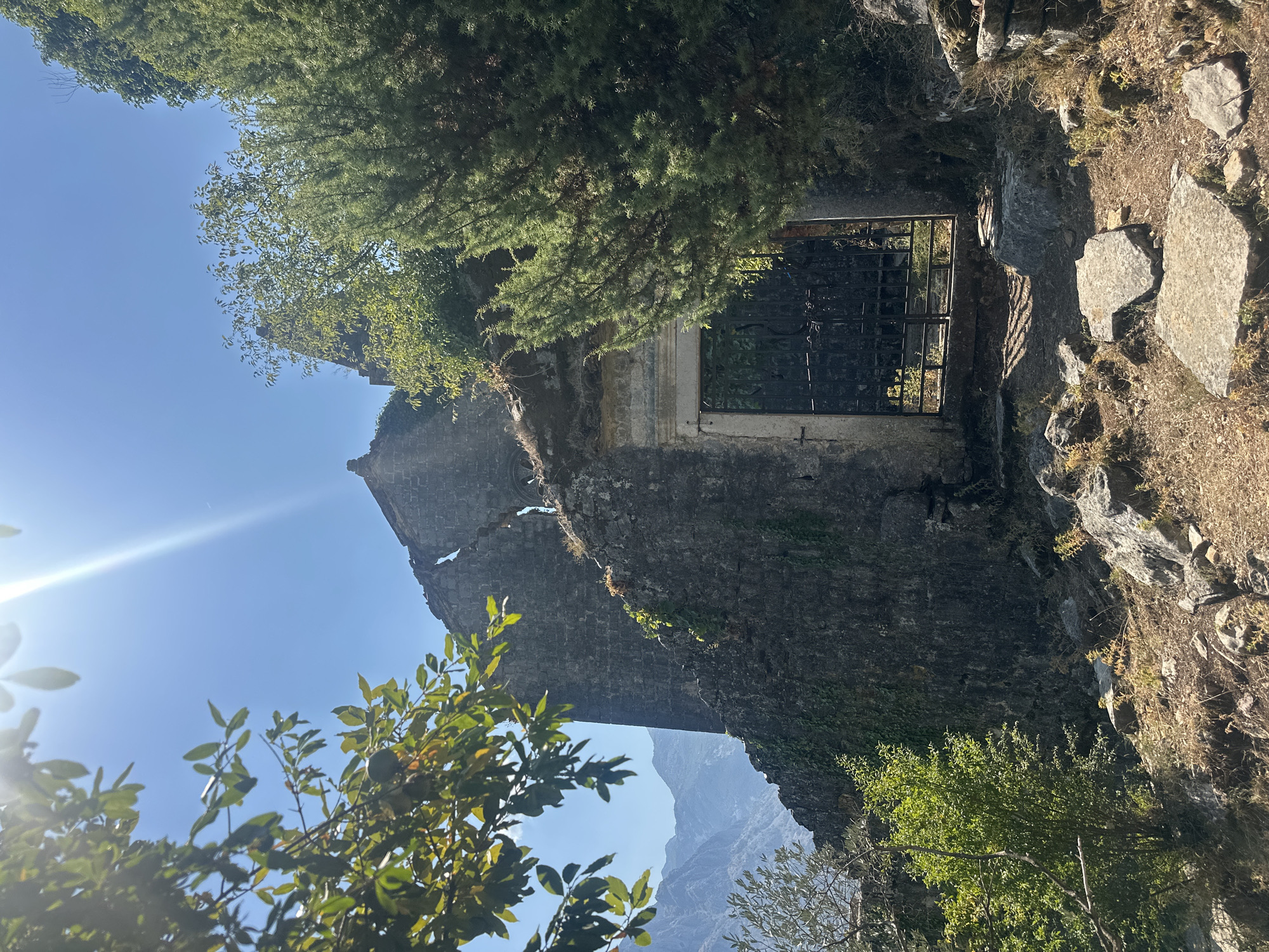 Exploring ruined stone church ruins above the Bay of Kotor, Prčanj