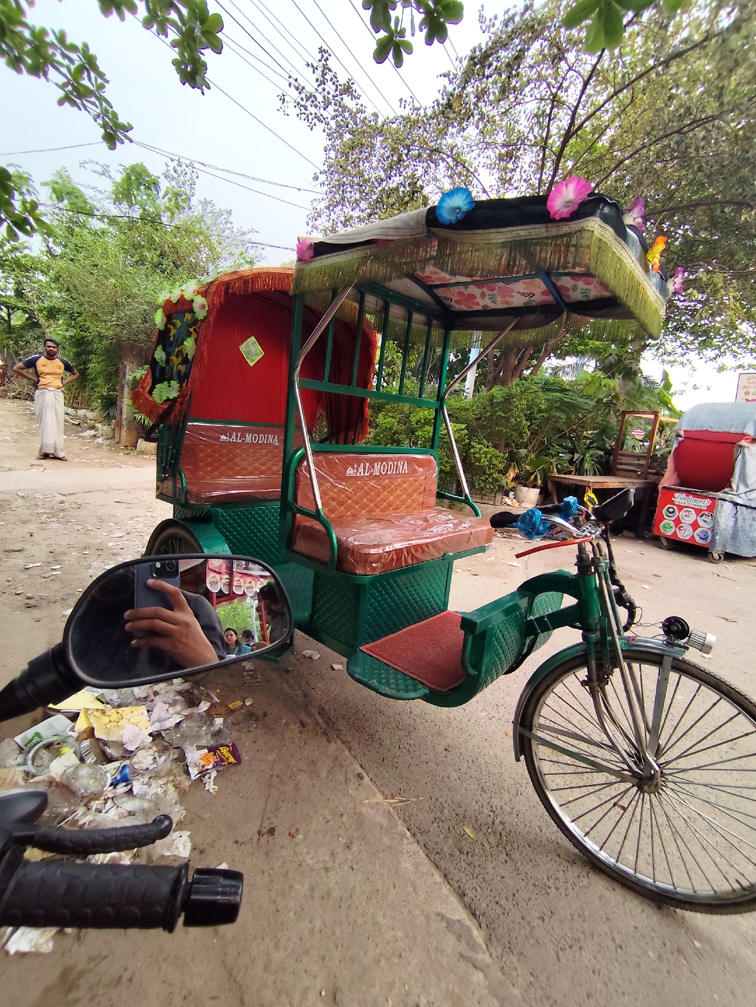 Morning street scenes show rickshaws, food carts in Dhaka