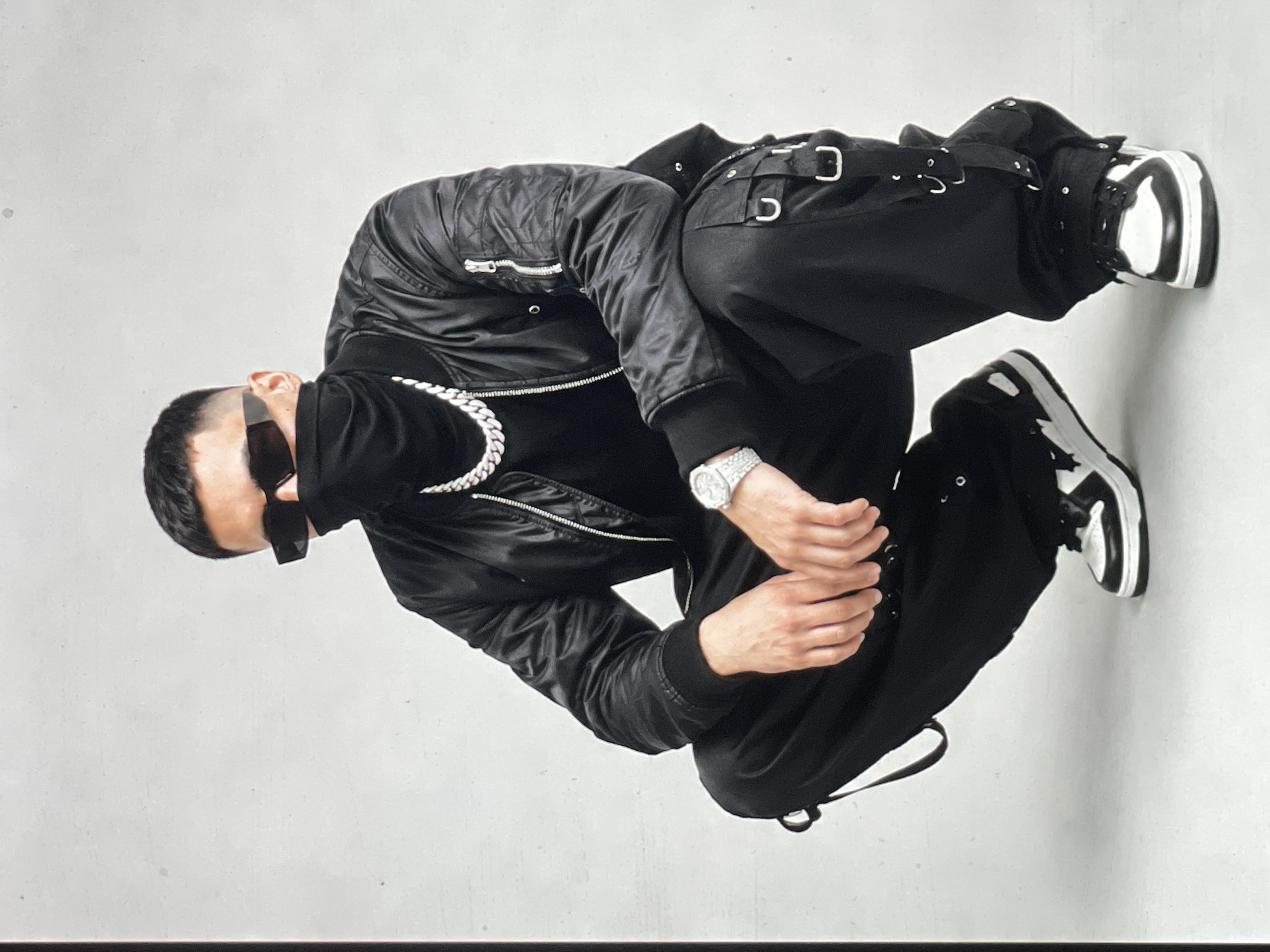 All-black streetwear looks shot against a clean Paris backdrop