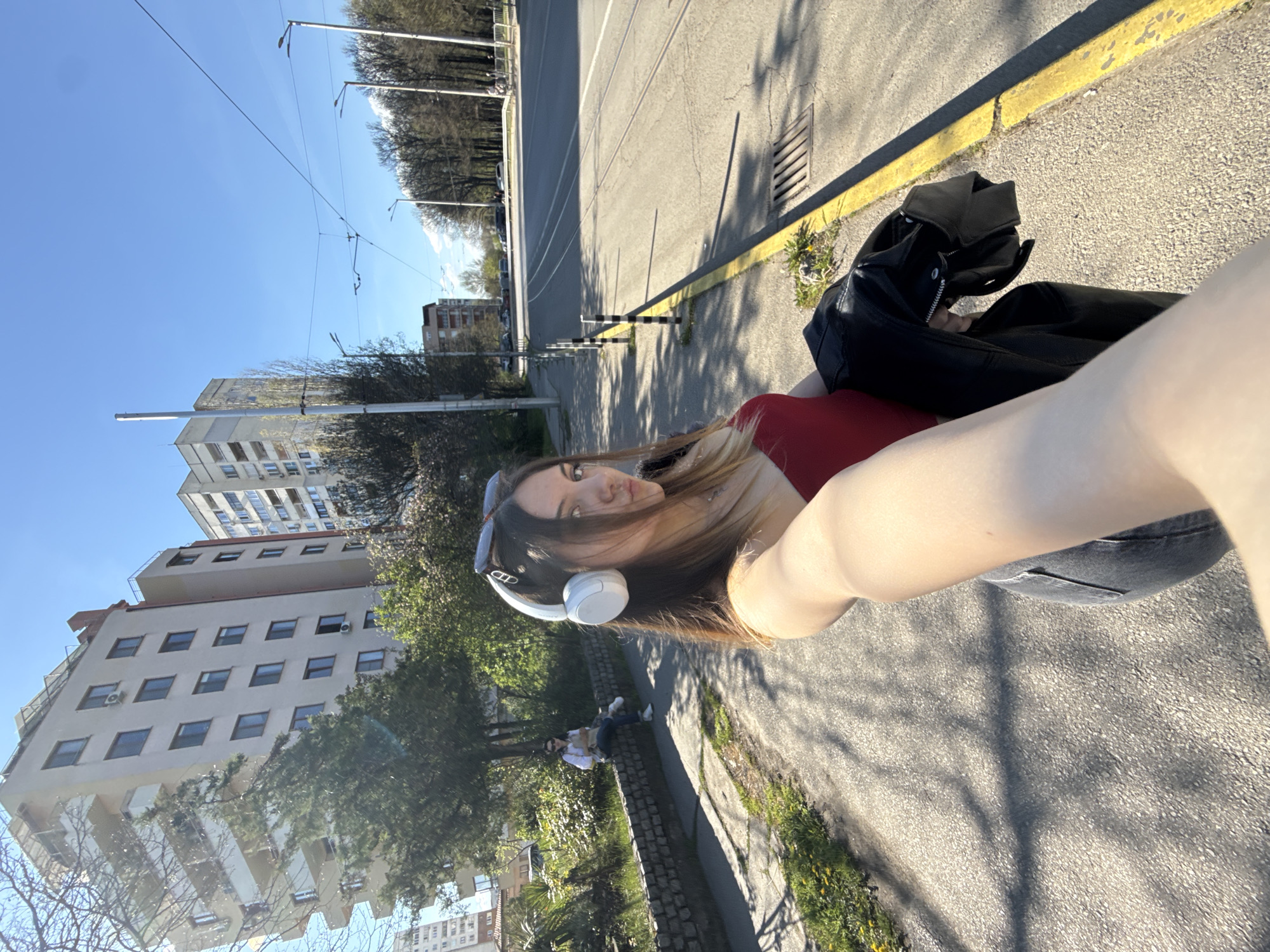 Woman takes selfie with leather jacket in Sofia