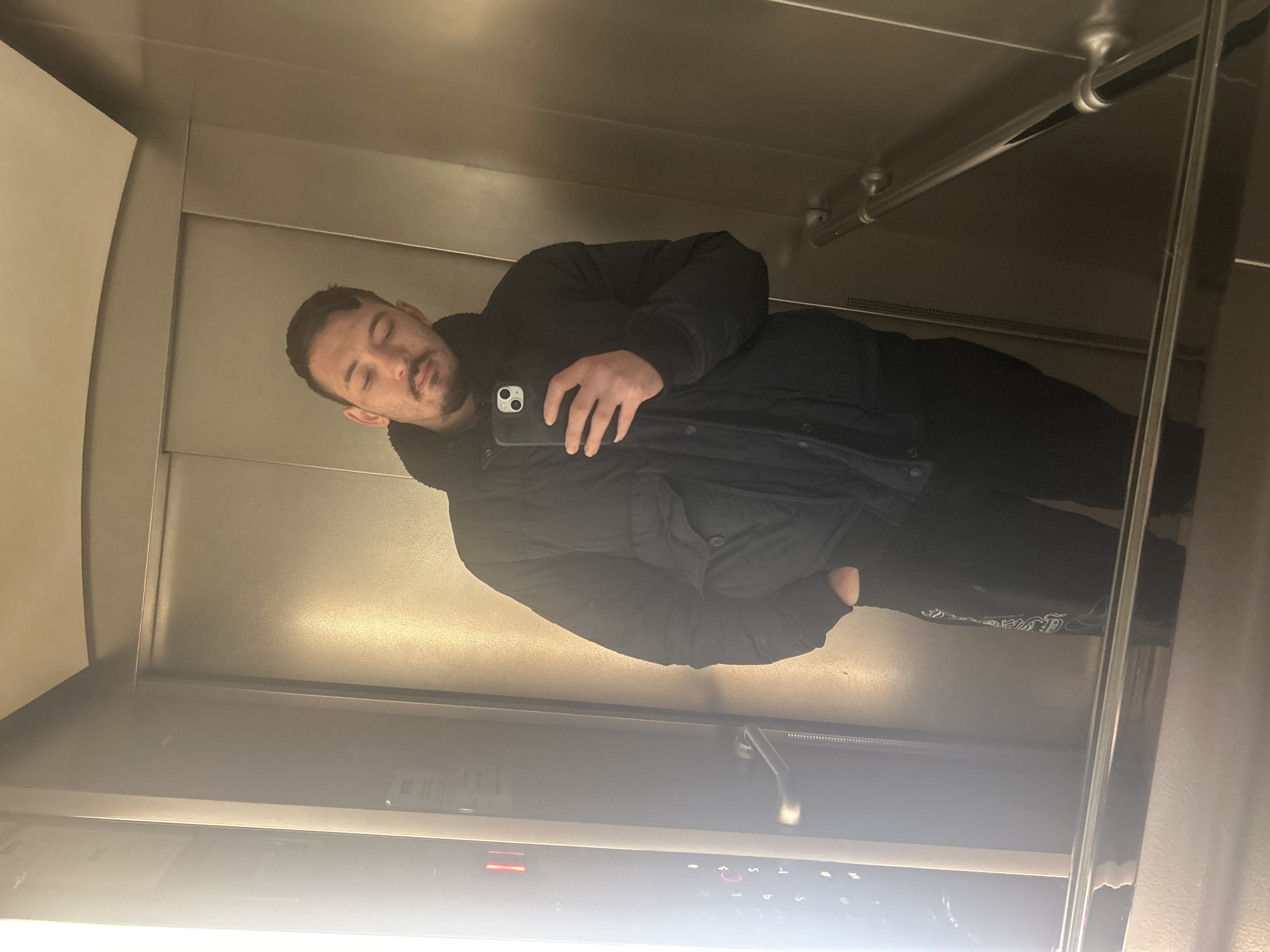 Man takes selfie in mirrored elevator in Varna