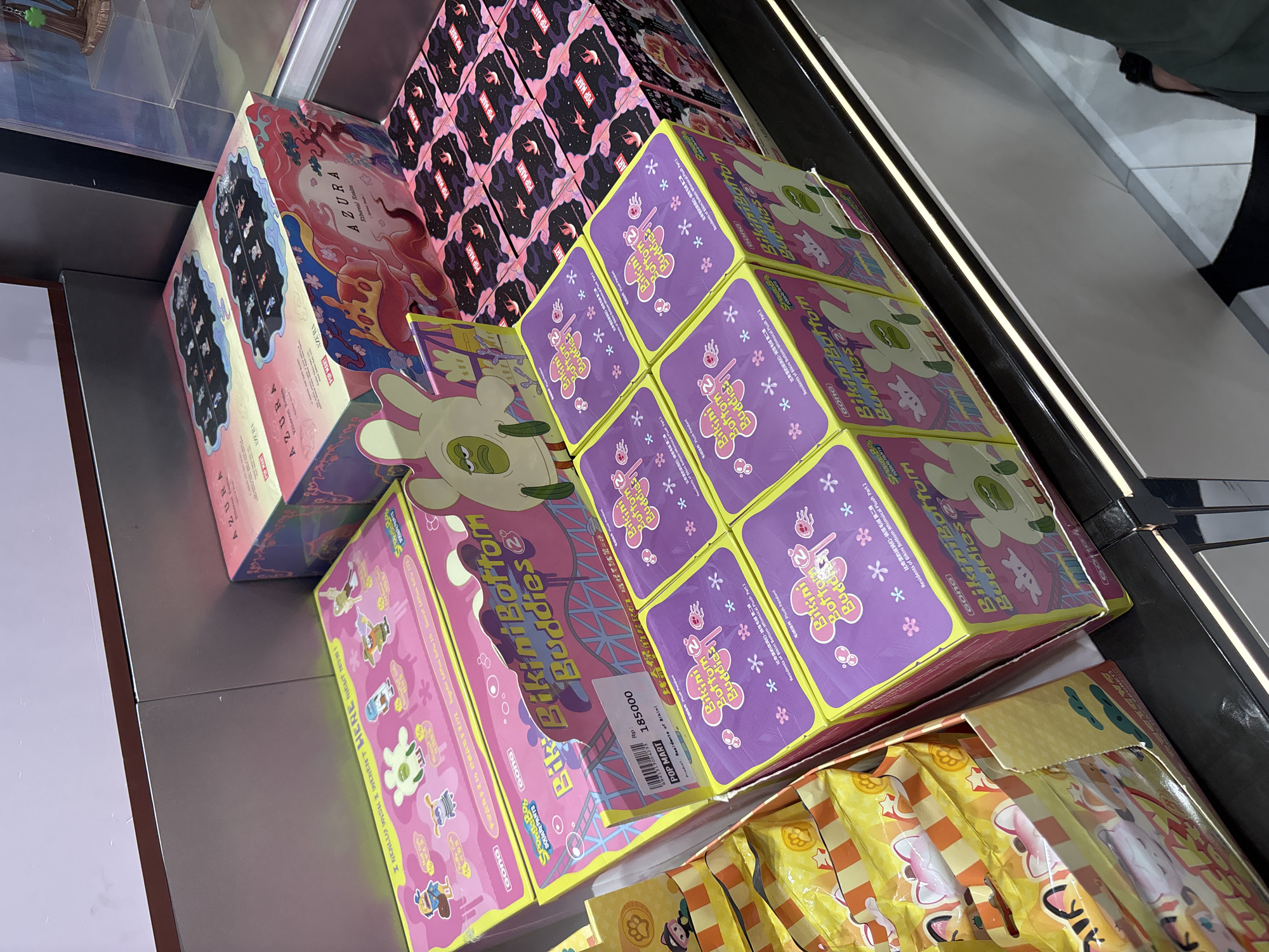Shopper documents toy collectibles at West Jakarta mall