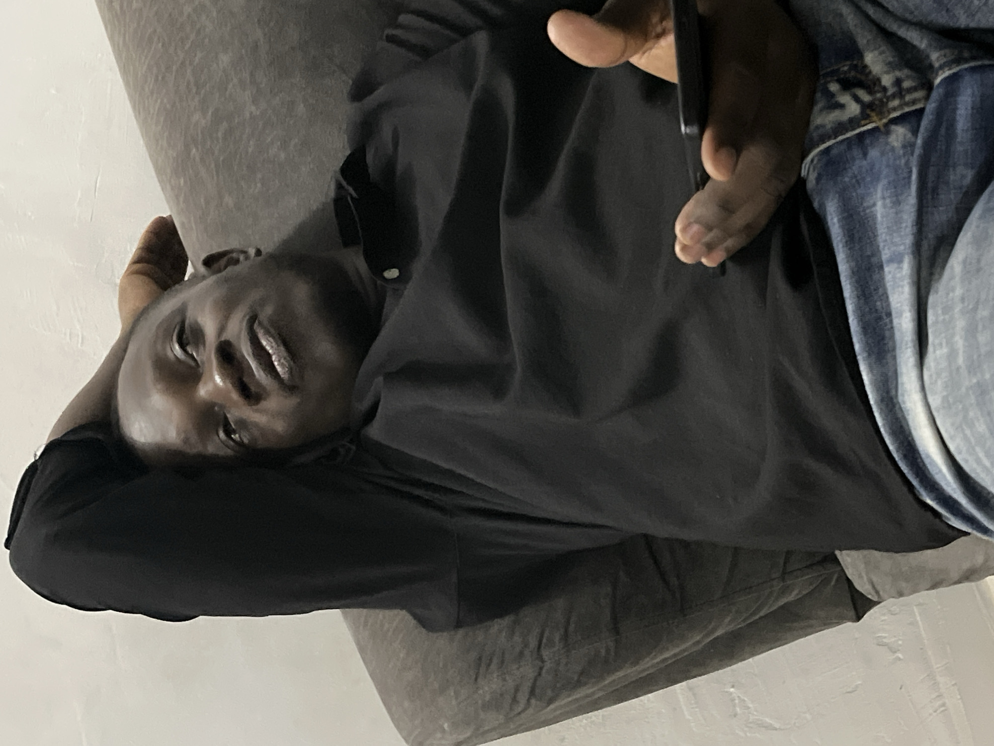 Casual evening at home in Abuja — phones, food, and downtime