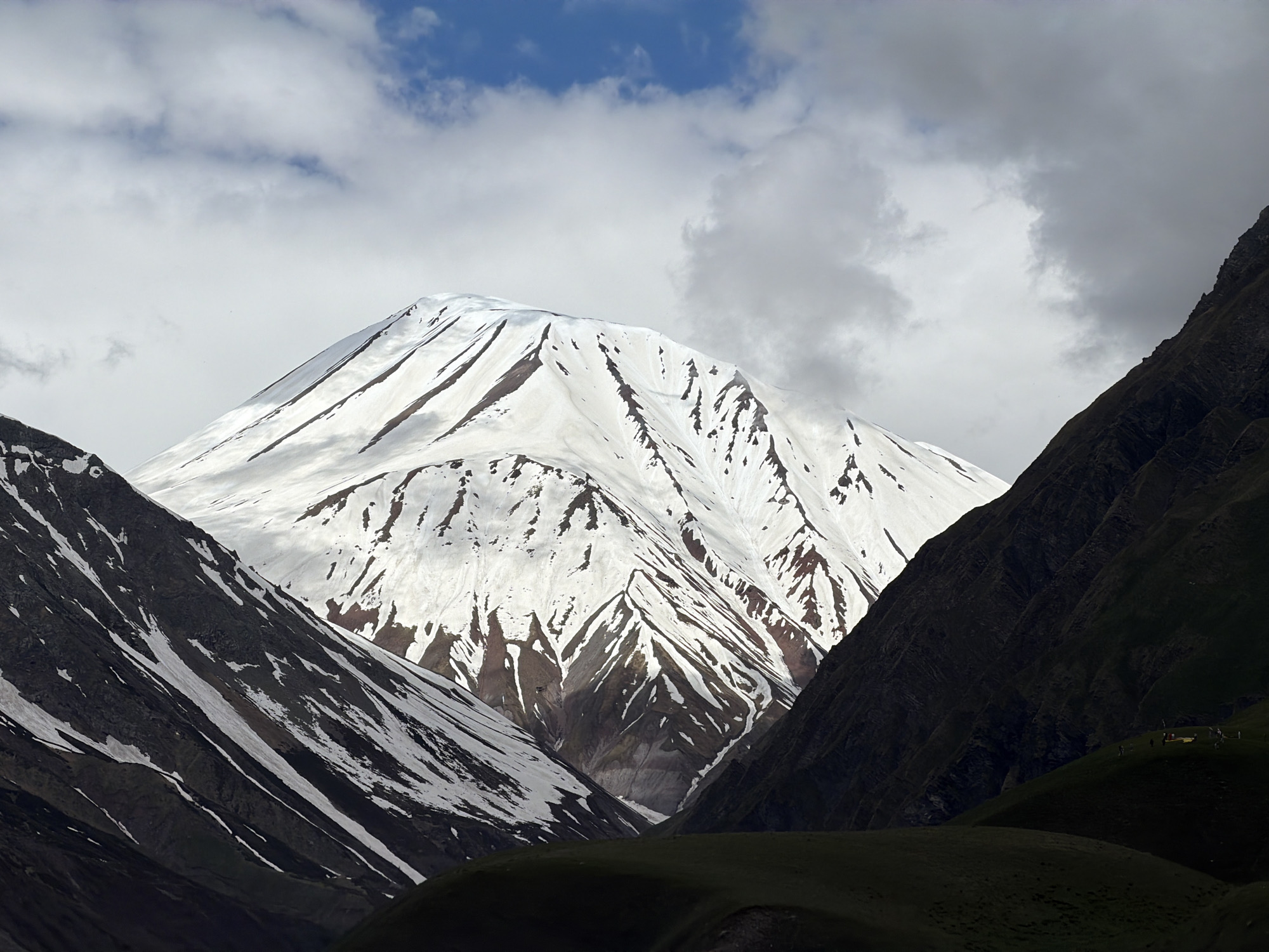 Snow-capped mountain peak dominates Gudauri landscape
