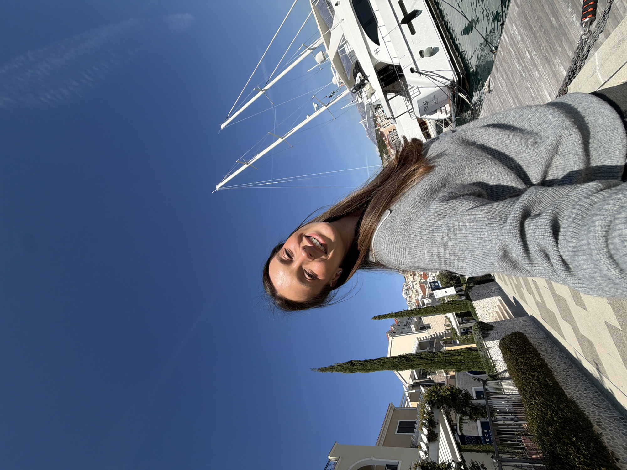 Woman visits marina, takes selfies in Radovići, Montenegro