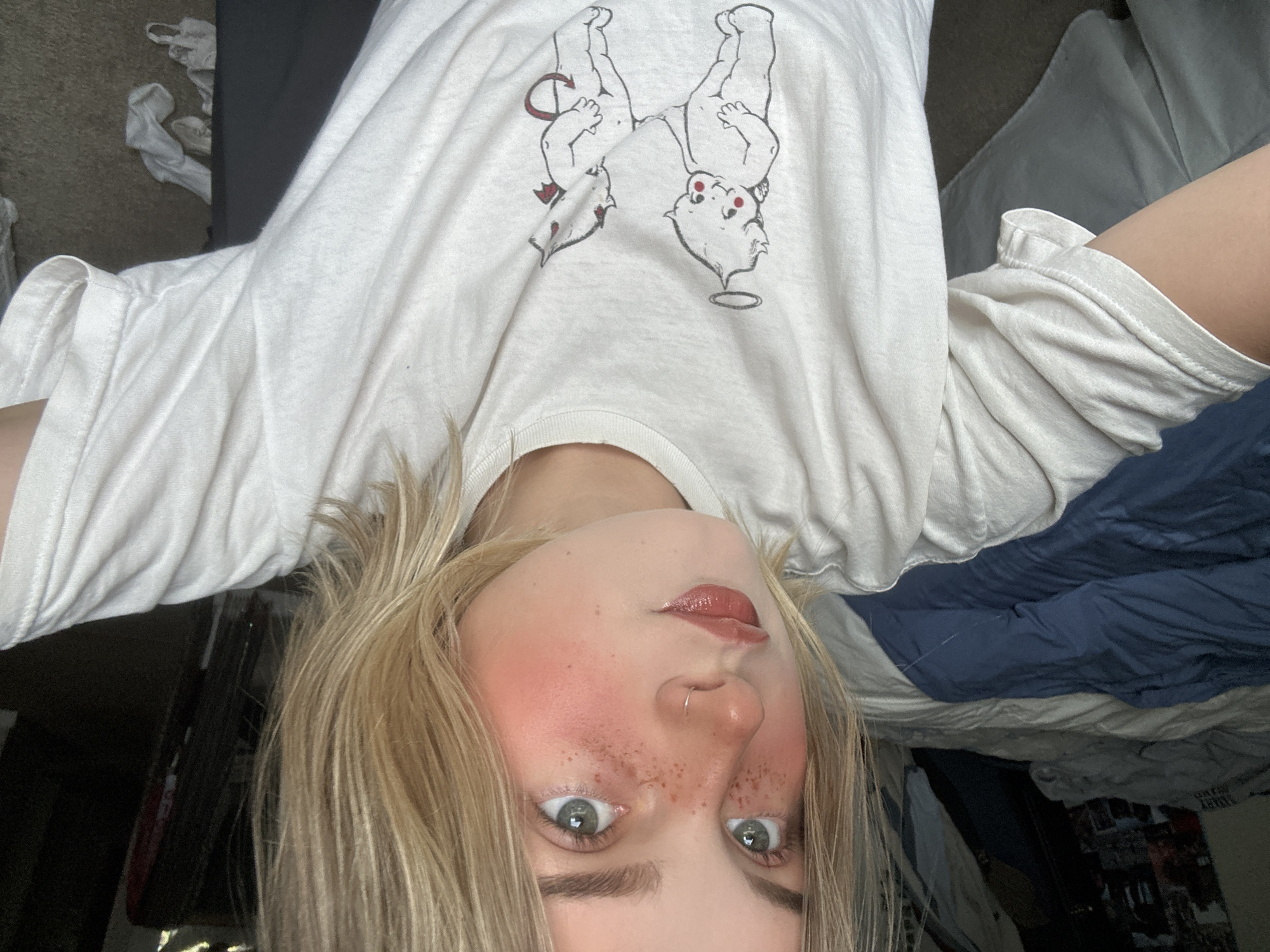 Young person with nose ring photographed upside down in Whistler