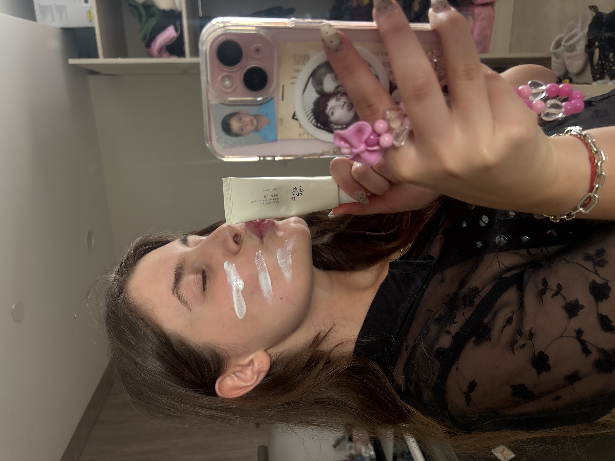 Woman documents skincare routine in selfie session in Getafe