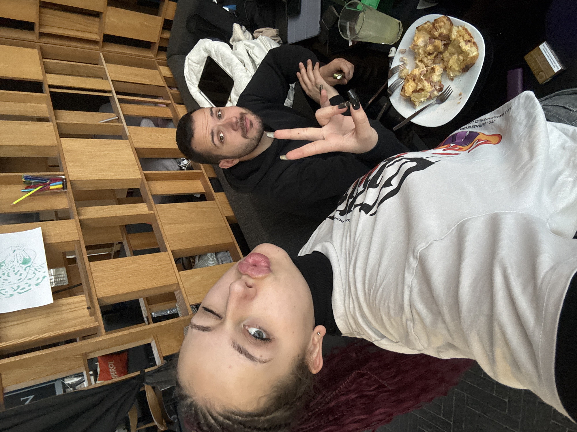 Two people pose with peace signs in Varna