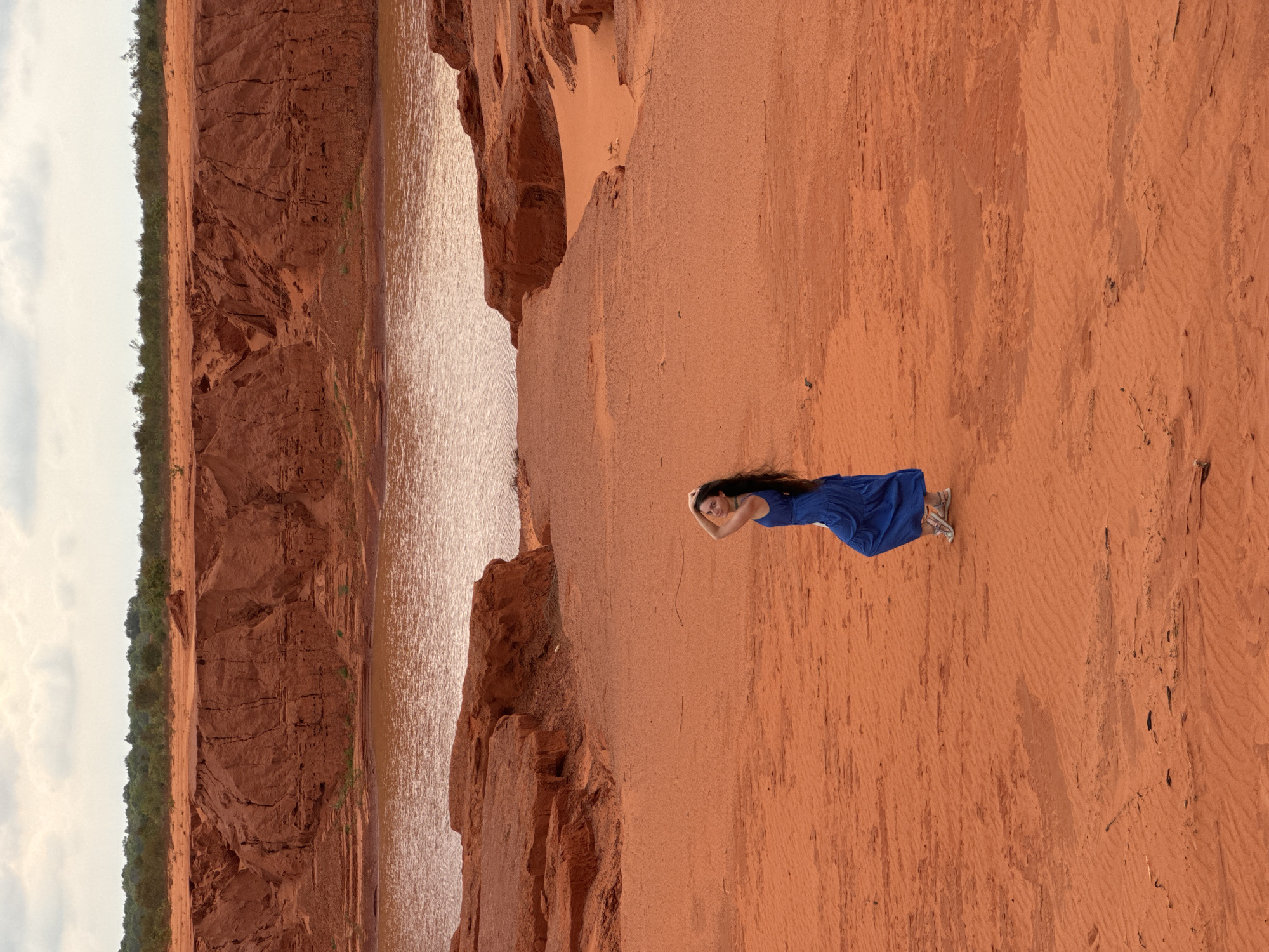 Woman in blue dress visits Mui Ne Red Sand Dunes