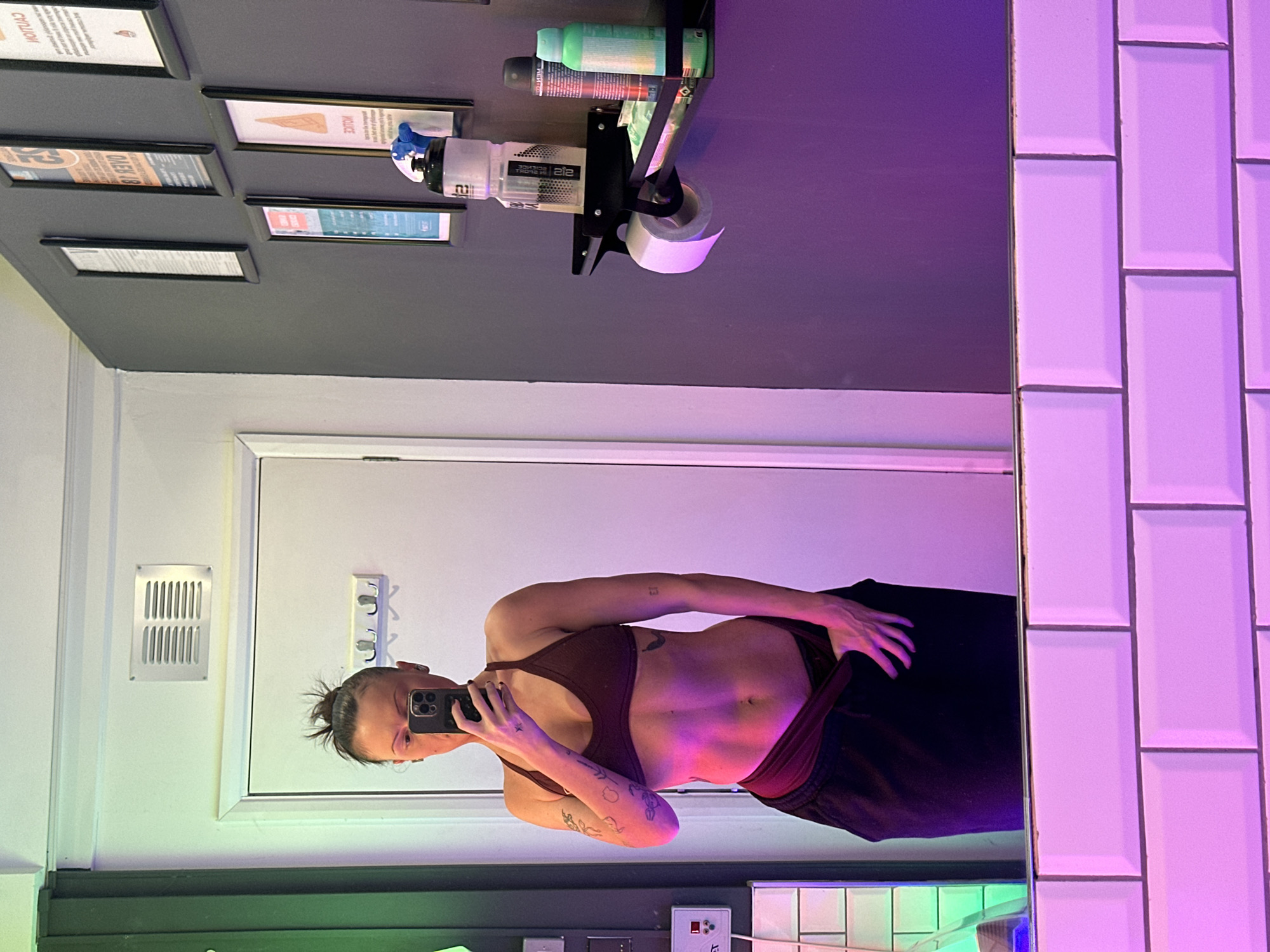 Person takes mirror selfies in UK bathroom