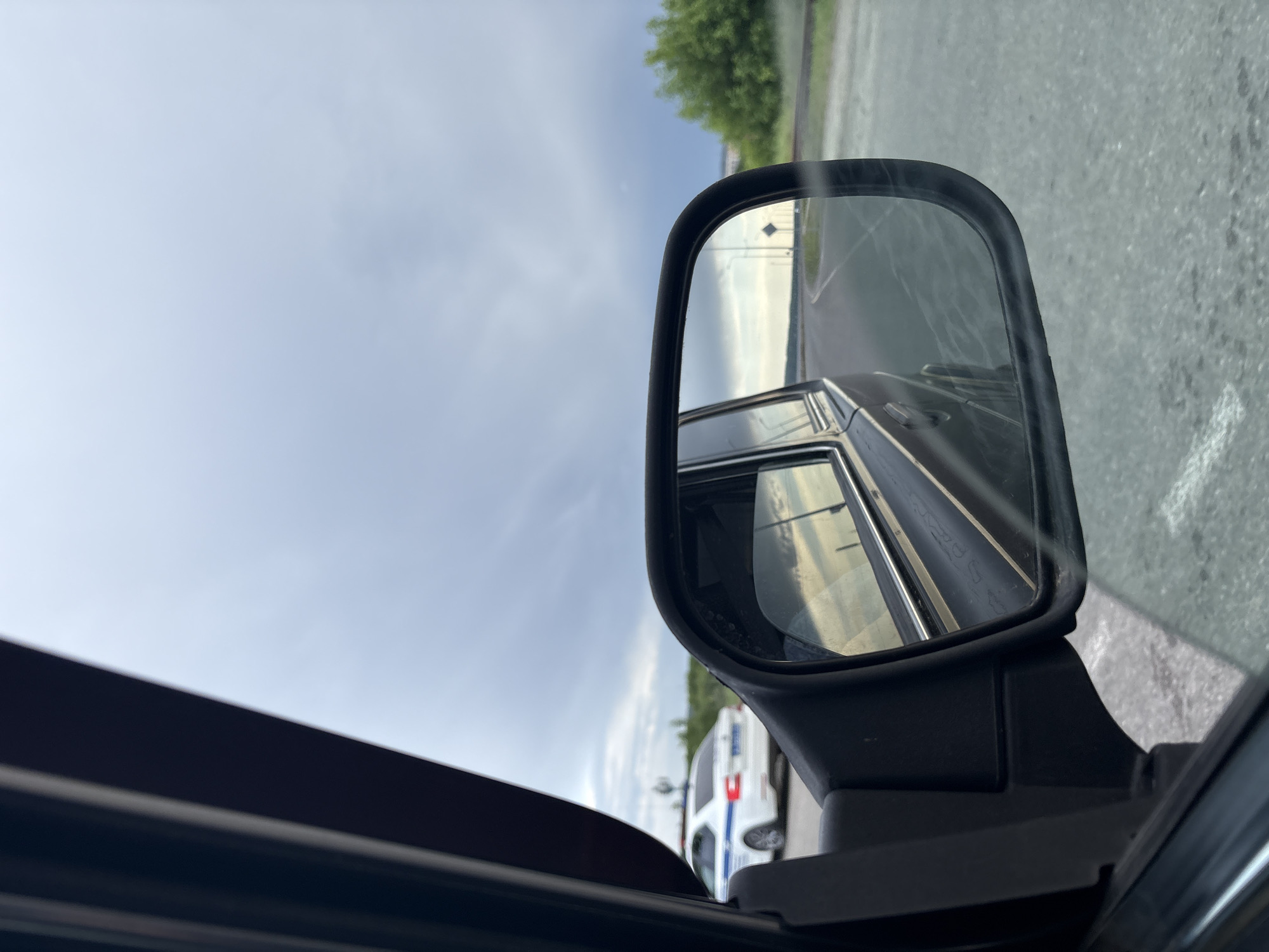 Storm clouds gather over Chaikovsky as vehicles navigate city