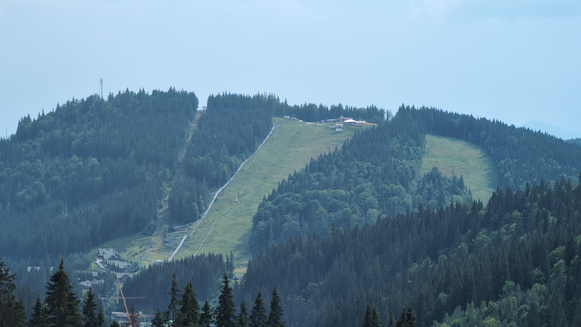 Mountain resort with ski slope and A-frame lodge structures