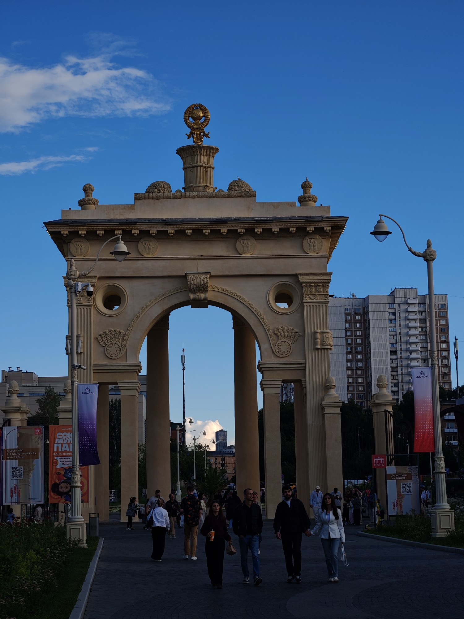 Ferris wheel, cable cars, and grand architecture at a fairground