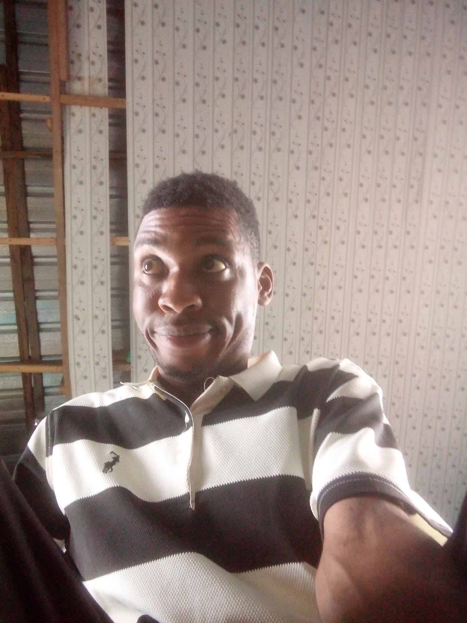 Man in striped polo shirt observed in Ikorodu, Nigeria