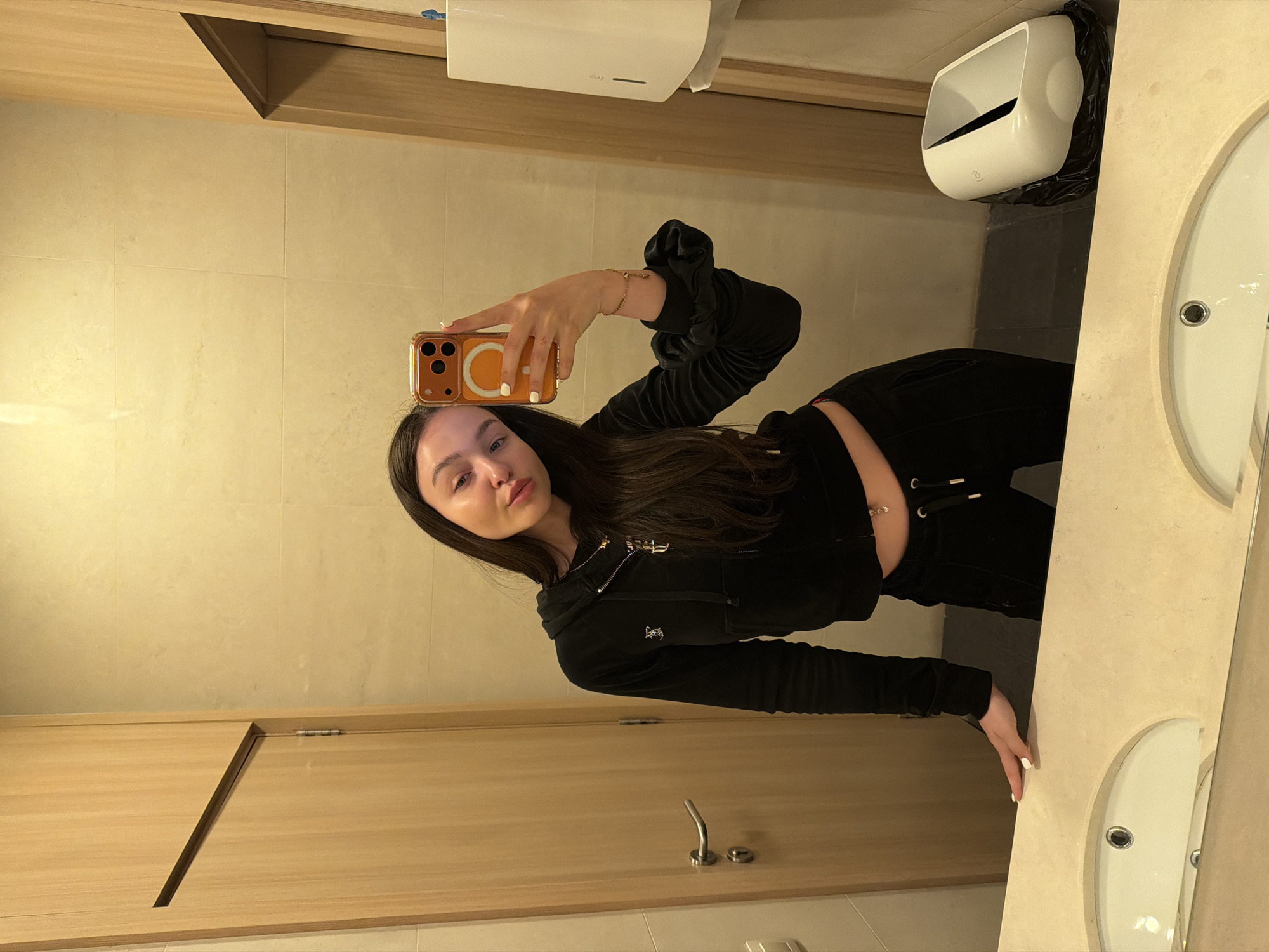 Woman Takes Mirror Selfie in Sofia Public Restroom