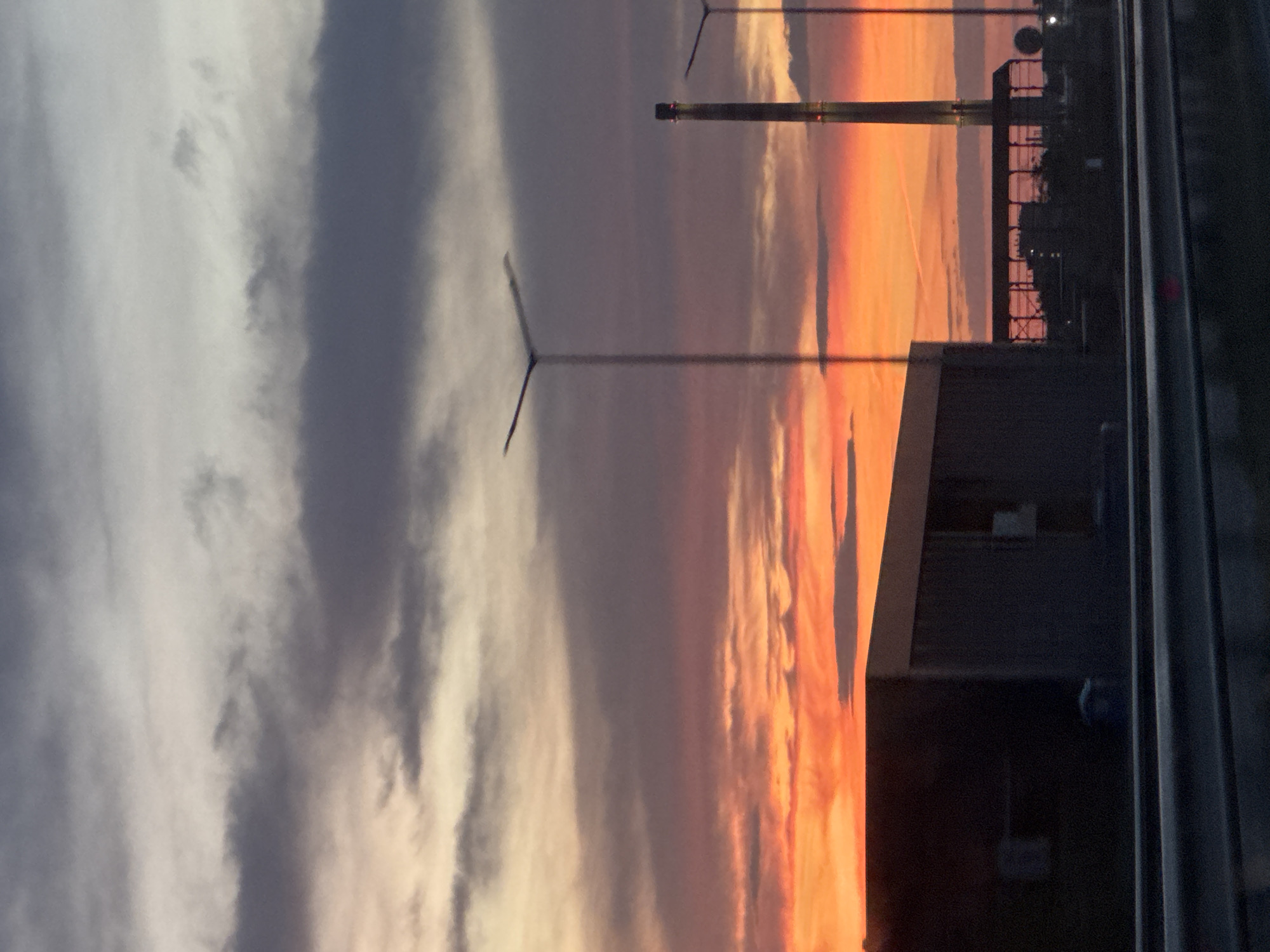 Sunset observed over Asenovgrad, Bulgaria with wind turbines visible