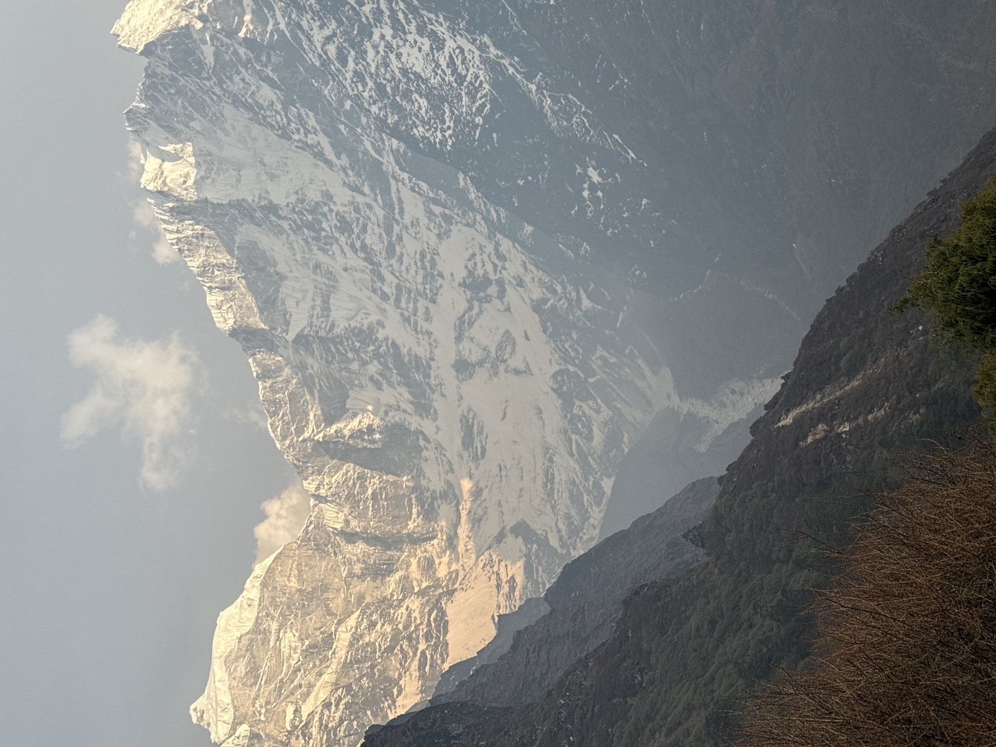Tourist enjoys drink amid Himalayan peaks near Tengboche