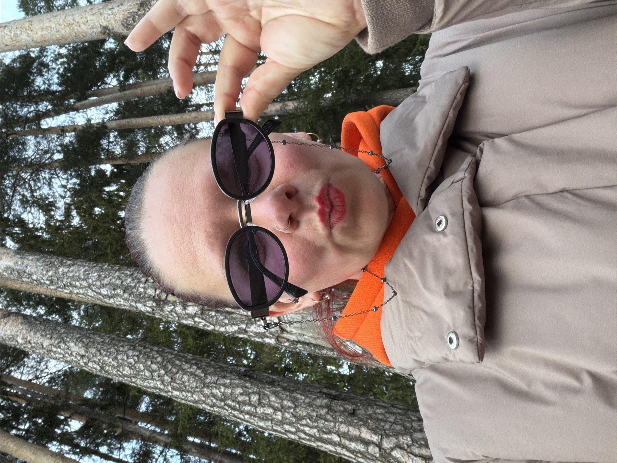 Person in orange jacket documented around Chaikovsky, Russia