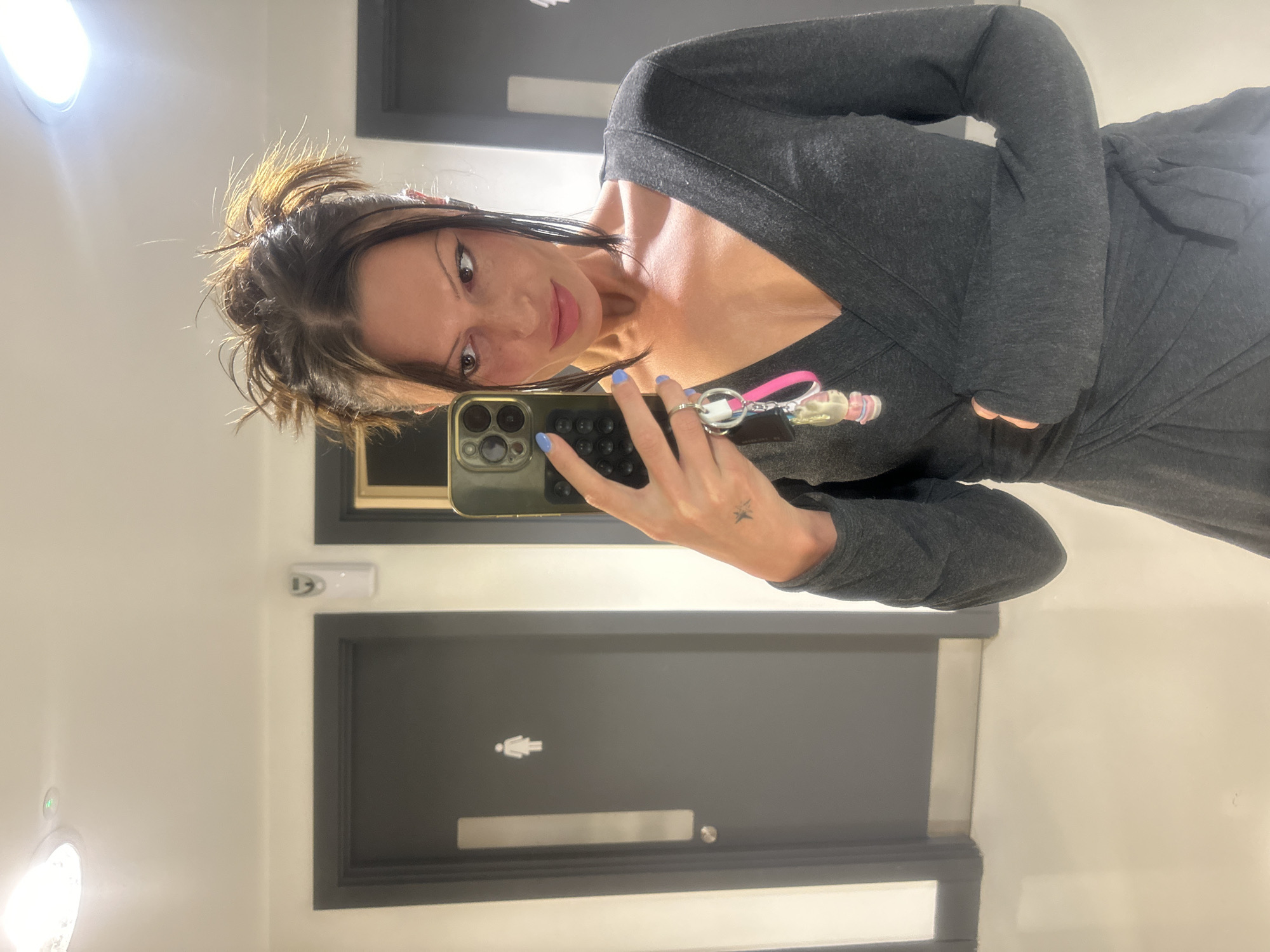 Woman takes selfie in London restroom