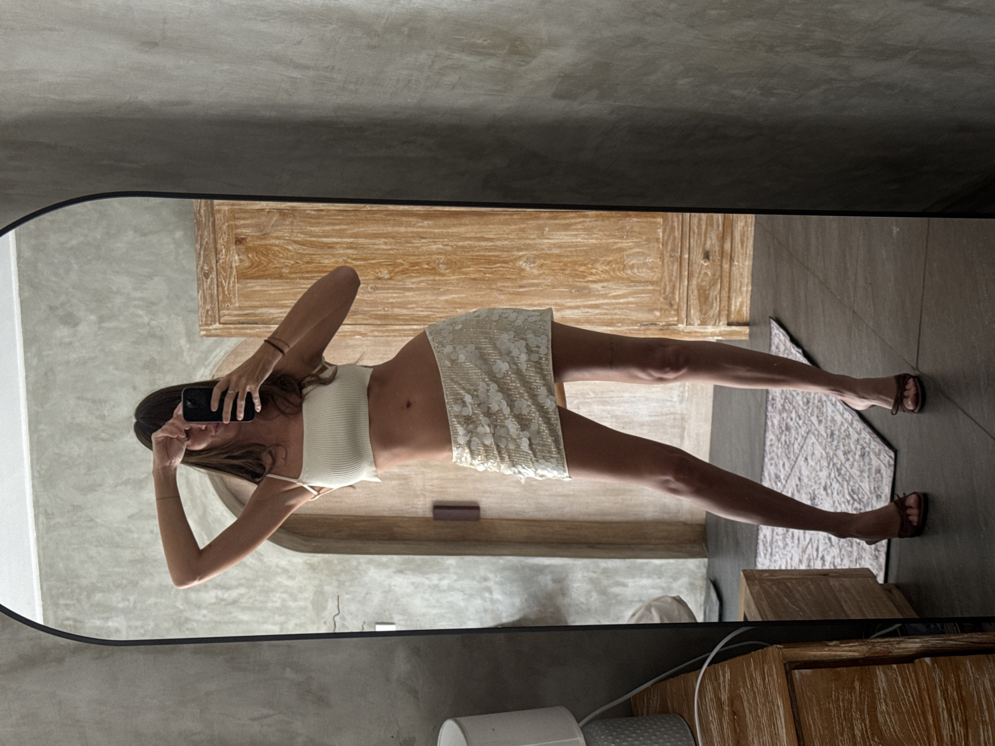 Woman takes mirror selfies in North Kuta, Indonesia