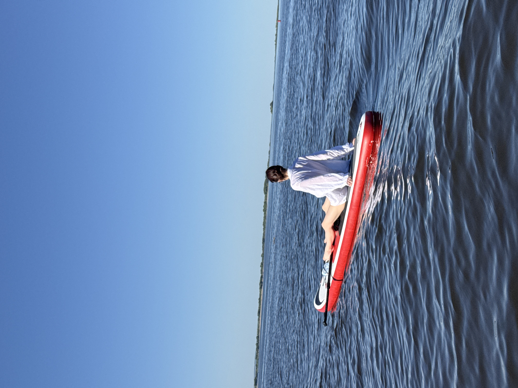Paddleboarders enjoy clear afternoon on Russian waters near Ust'-Kurdium