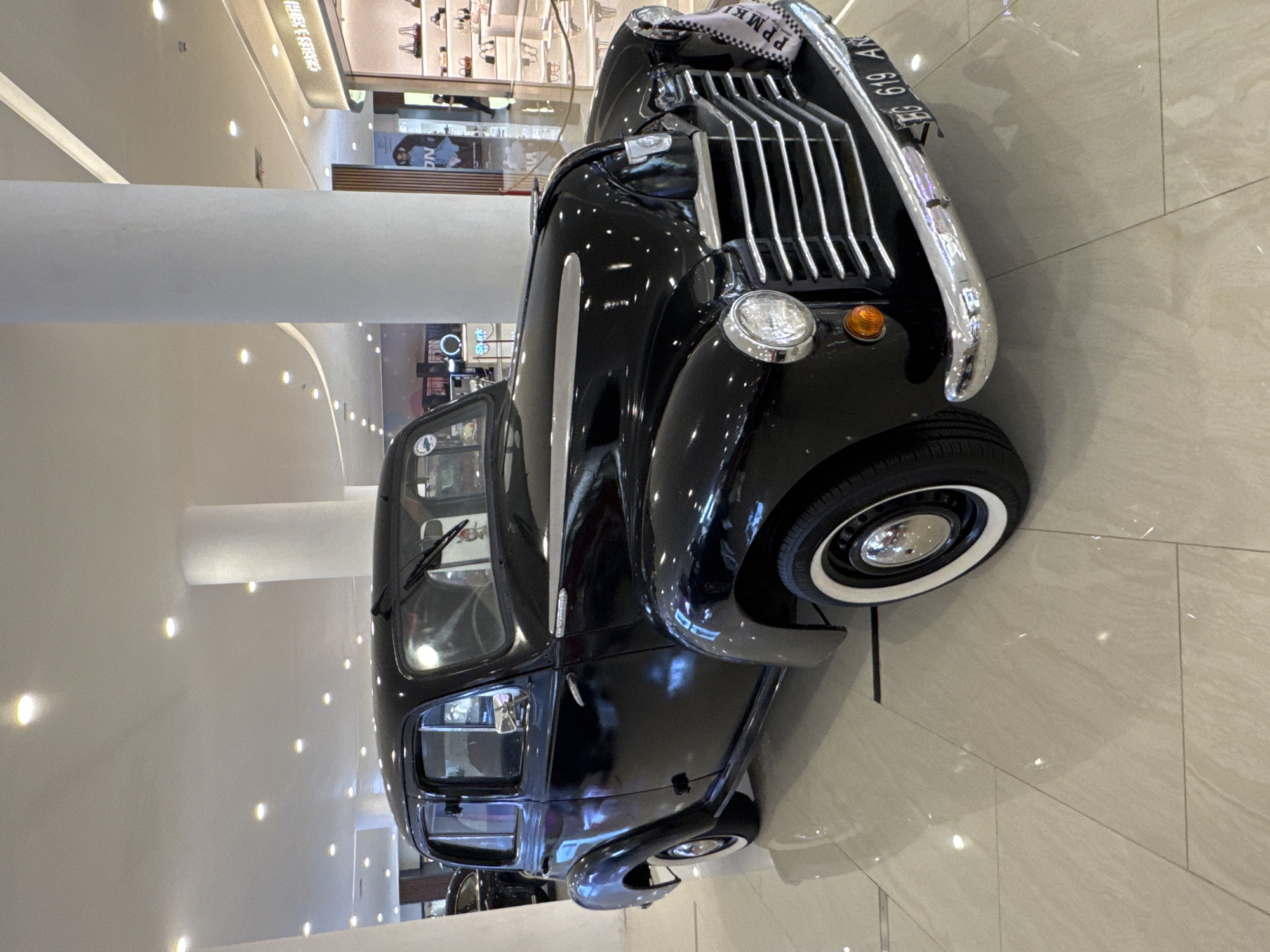 Vintage car show displayed at Indonesian shopping mall