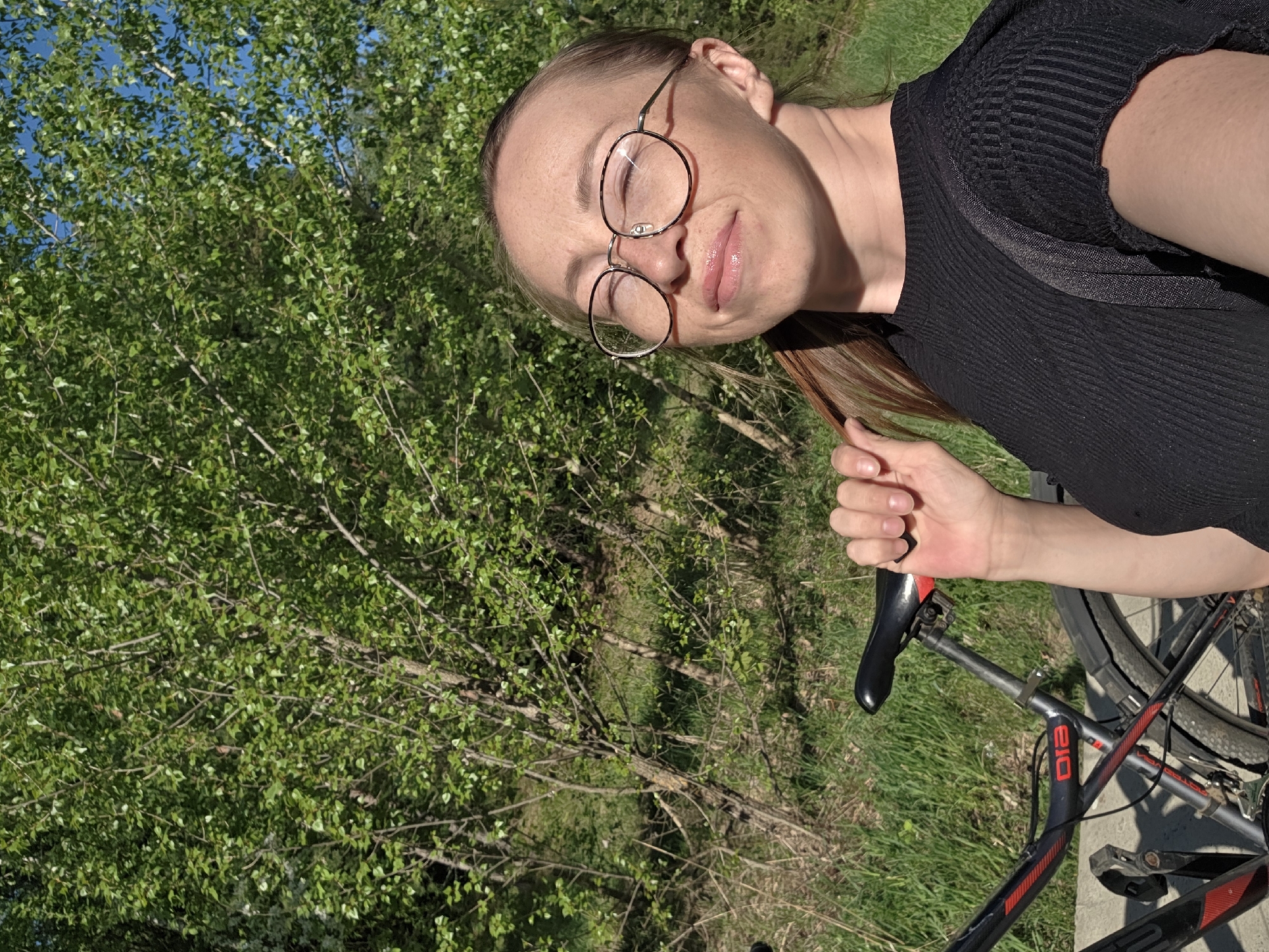 Woman with bicycle spotted outside residential building in Chaikovsky