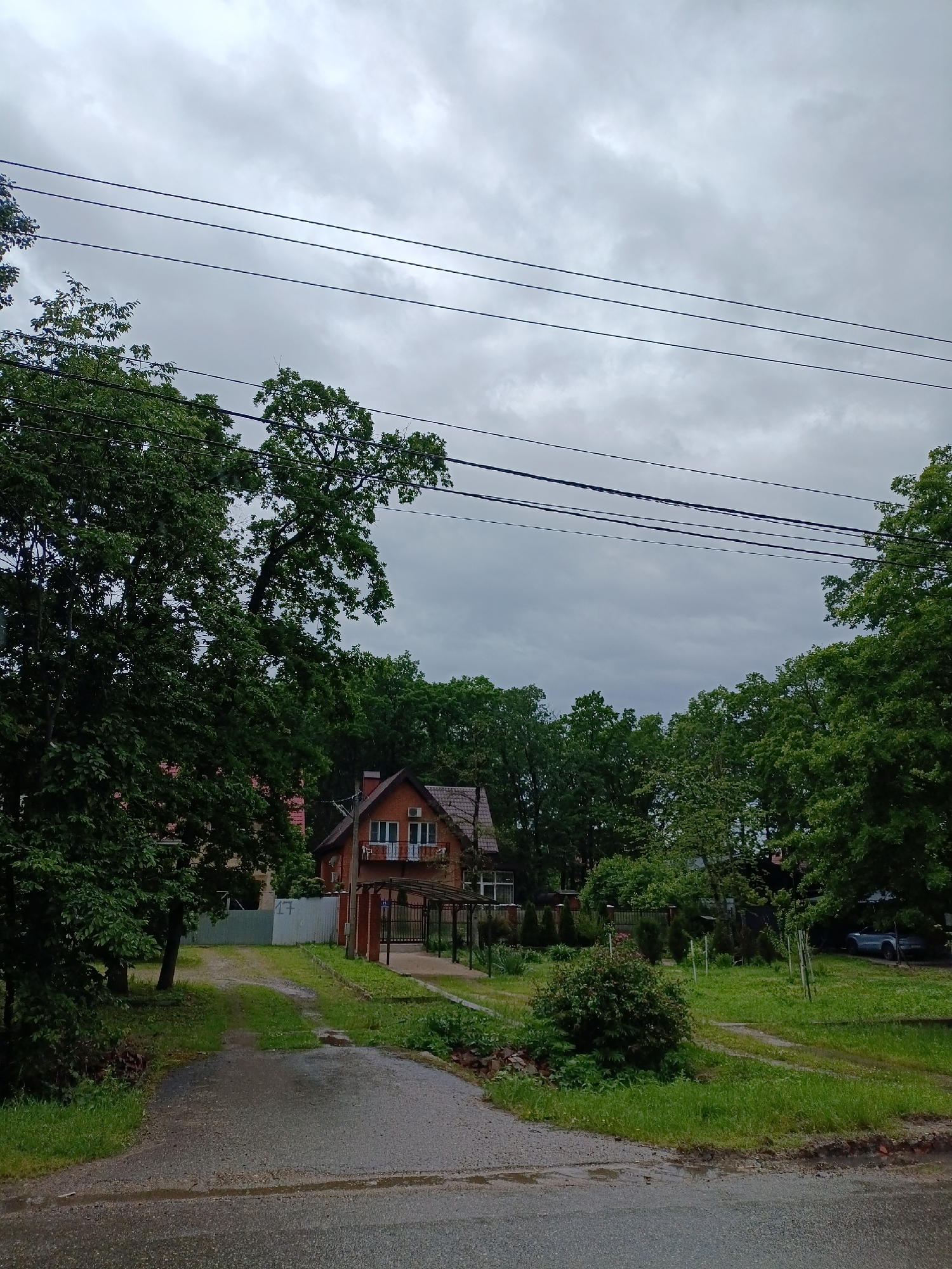 Wet morning streets documented across Goryachiy Klyuch, Russia