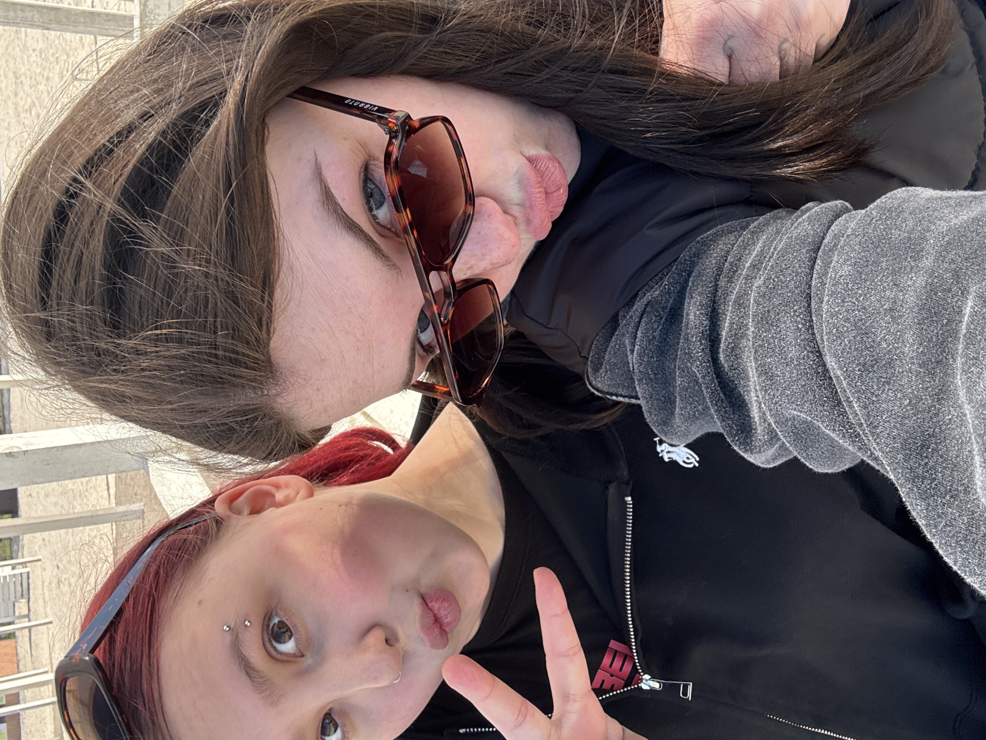 Two people take playful selfie in Chornomorskoe, Ukraine