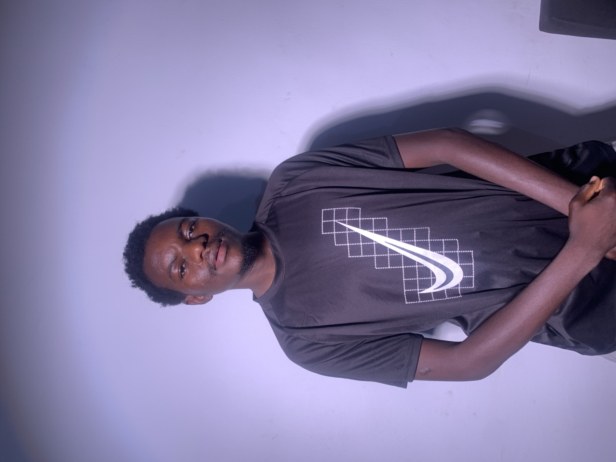 Studio portrait session in consistent Nike outfit, multiple angles.
