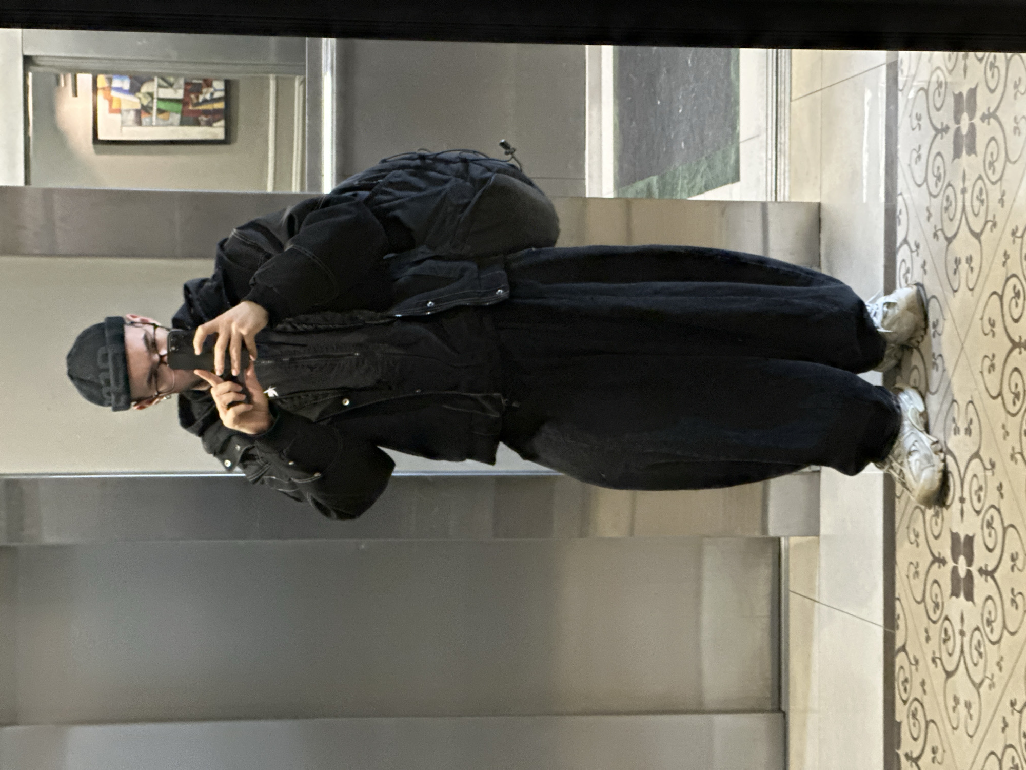 Person takes selfie in mirrored elevator in Khimki