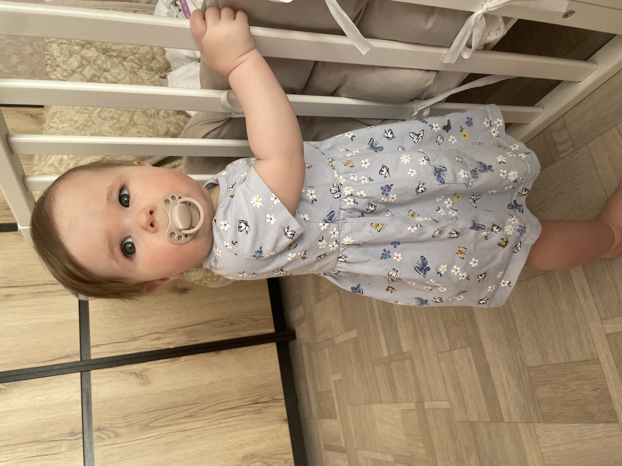 Baby in yellow elephant onesie photographed in Chaikovsky