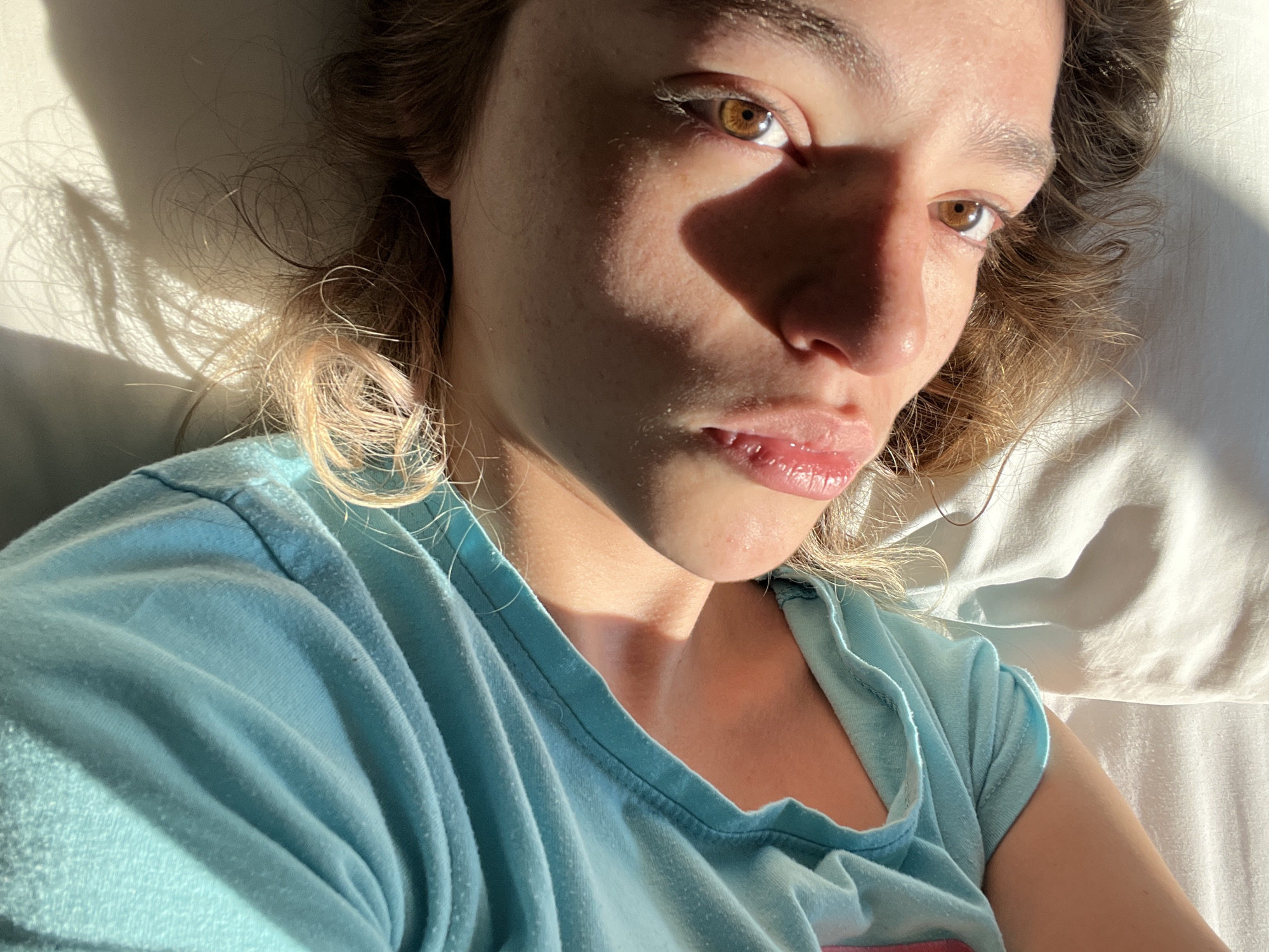 Woman takes selfies on bed in Mexican town