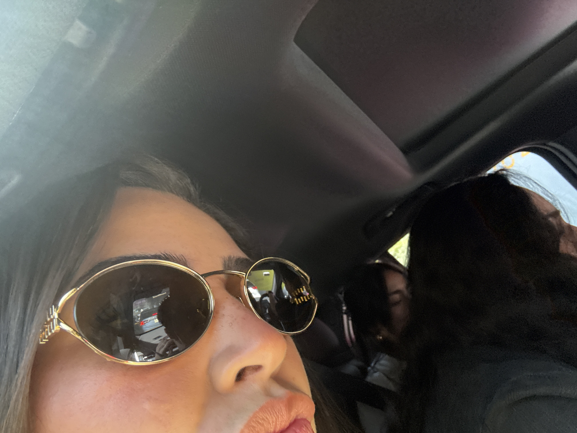 Woman takes selfies, drinks La Croix during Mexico City car ride