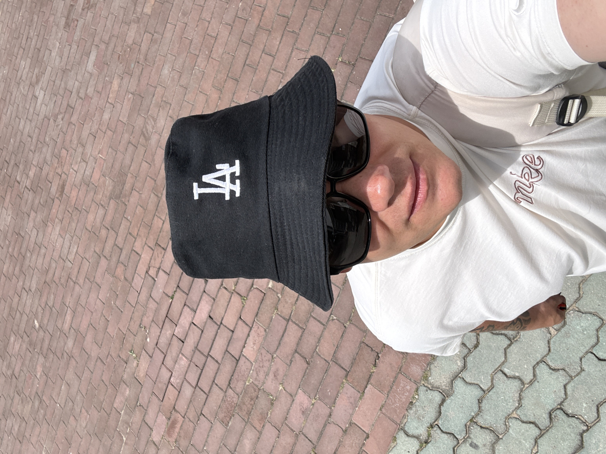 Sunny selfie on a red brick path in Qinhuangdao