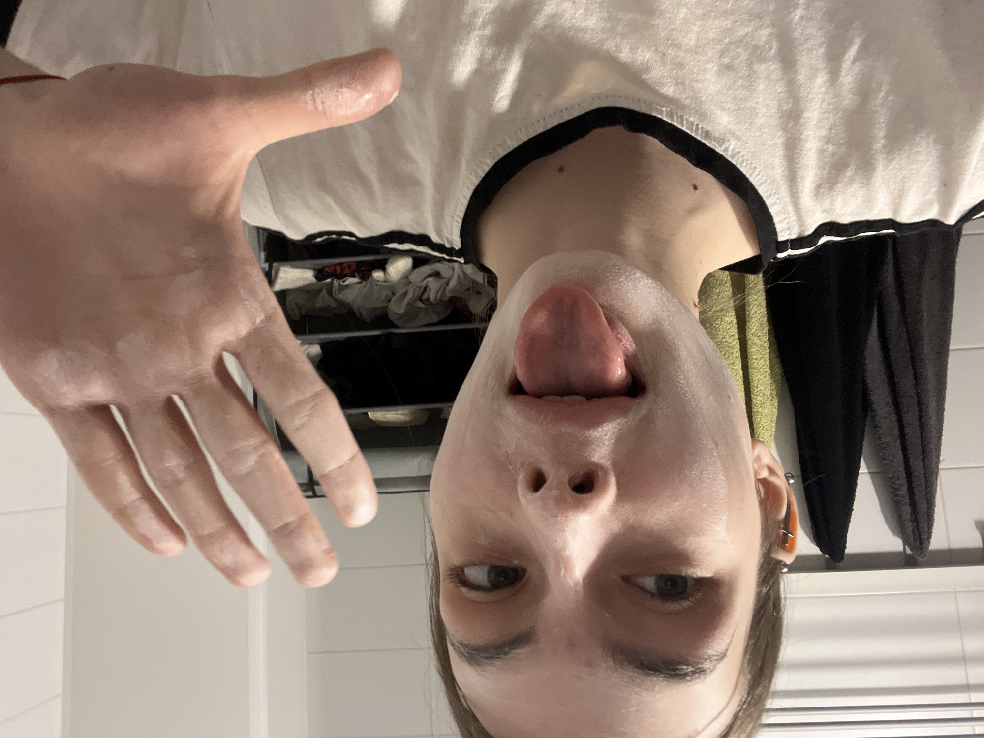 Young woman documents morning skincare routine in Saint Petersburg selfies