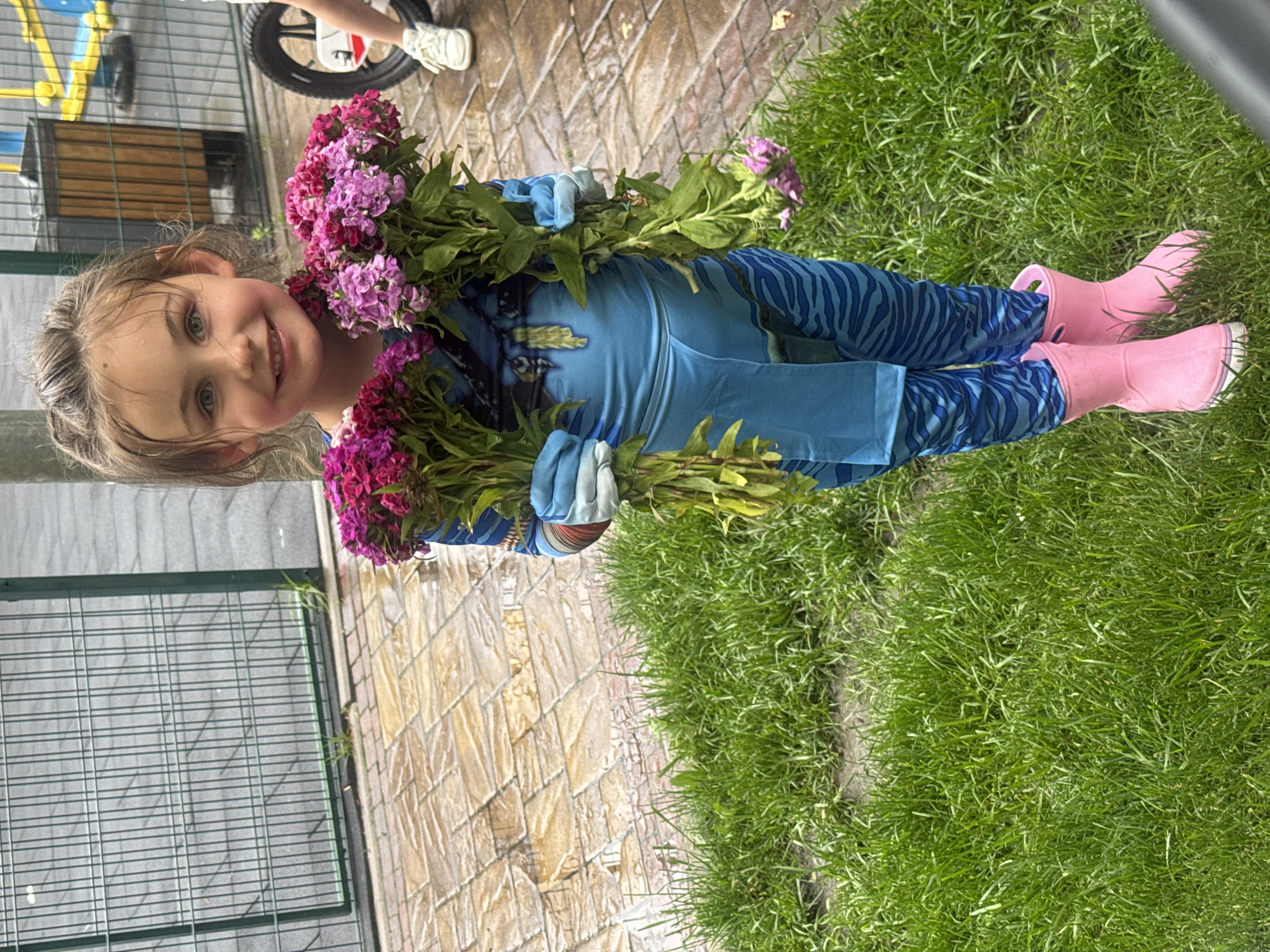 Young girl in blue costume photographed at Ukraine park