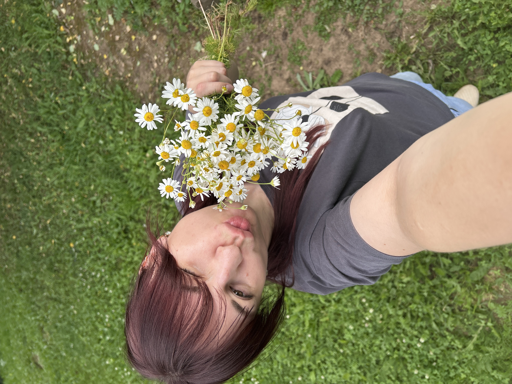 Lazy afternoon in the grass with a daisy bouquet