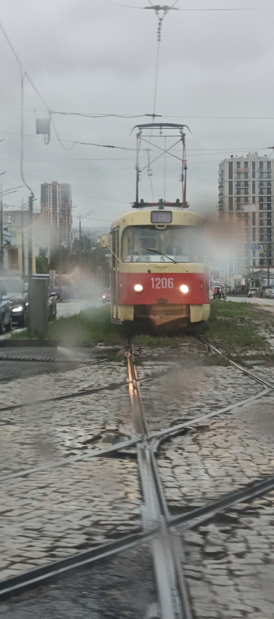 Trams rolling through a rainy Izhevsk afternoon