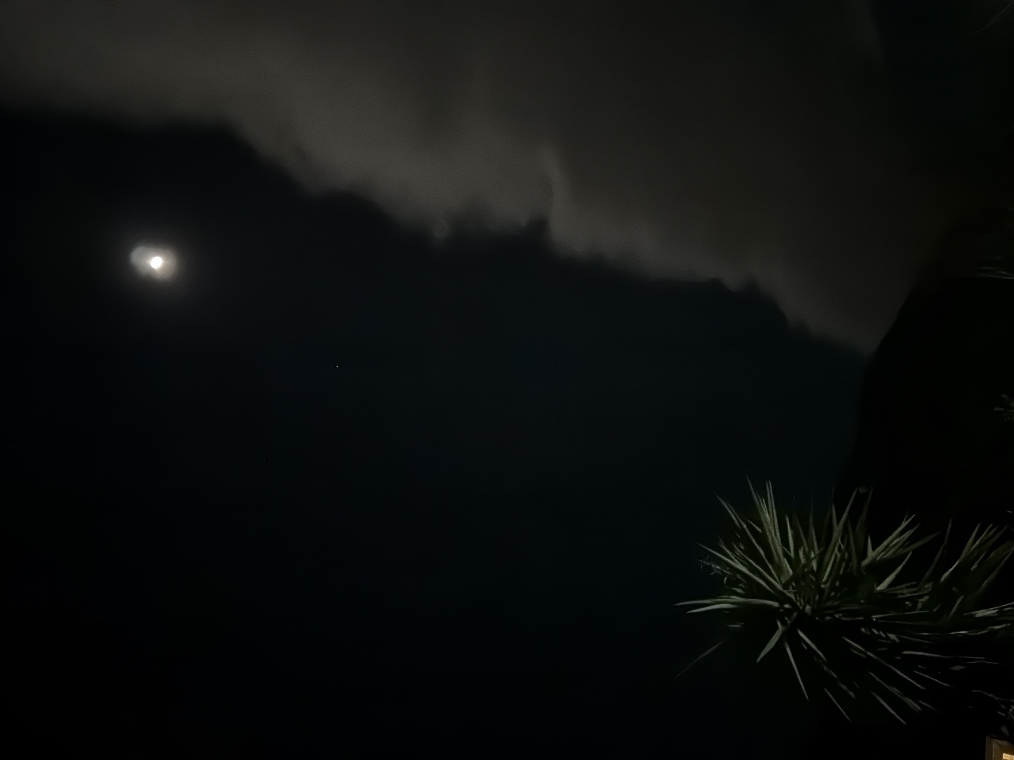 Nighttime moon and construction light documented in Budva