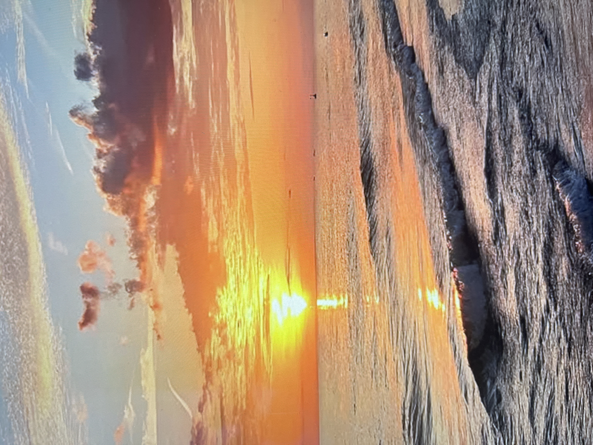 Sunset reflected on beach waters captured in Sofia