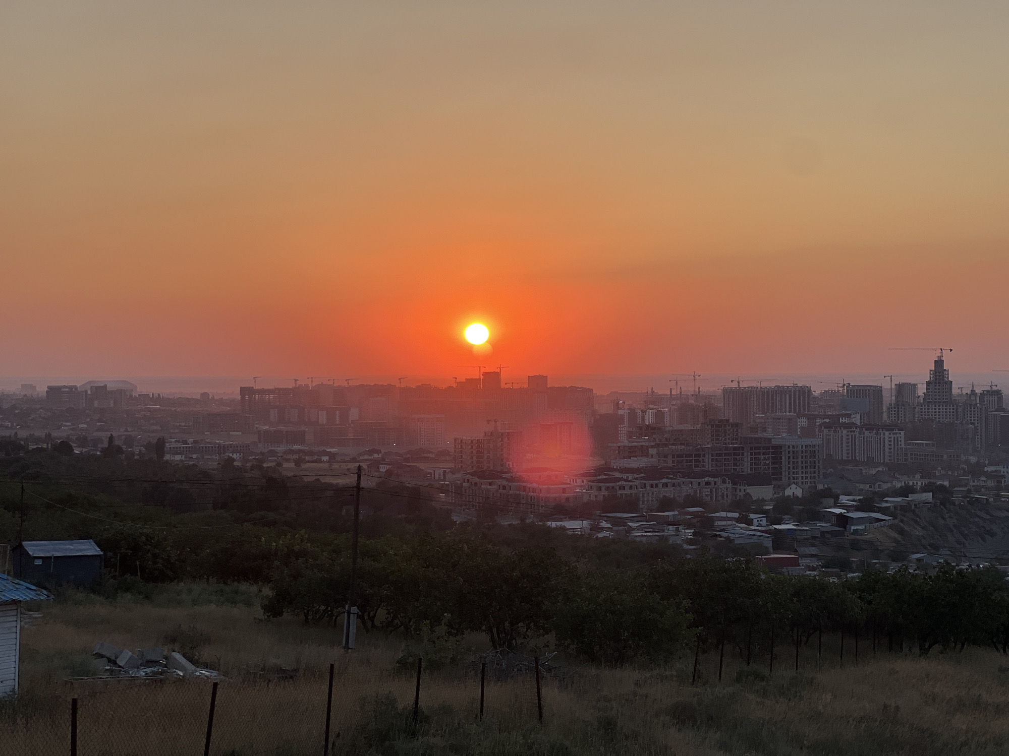 Sunset over Bishkek, golden domes and open sky