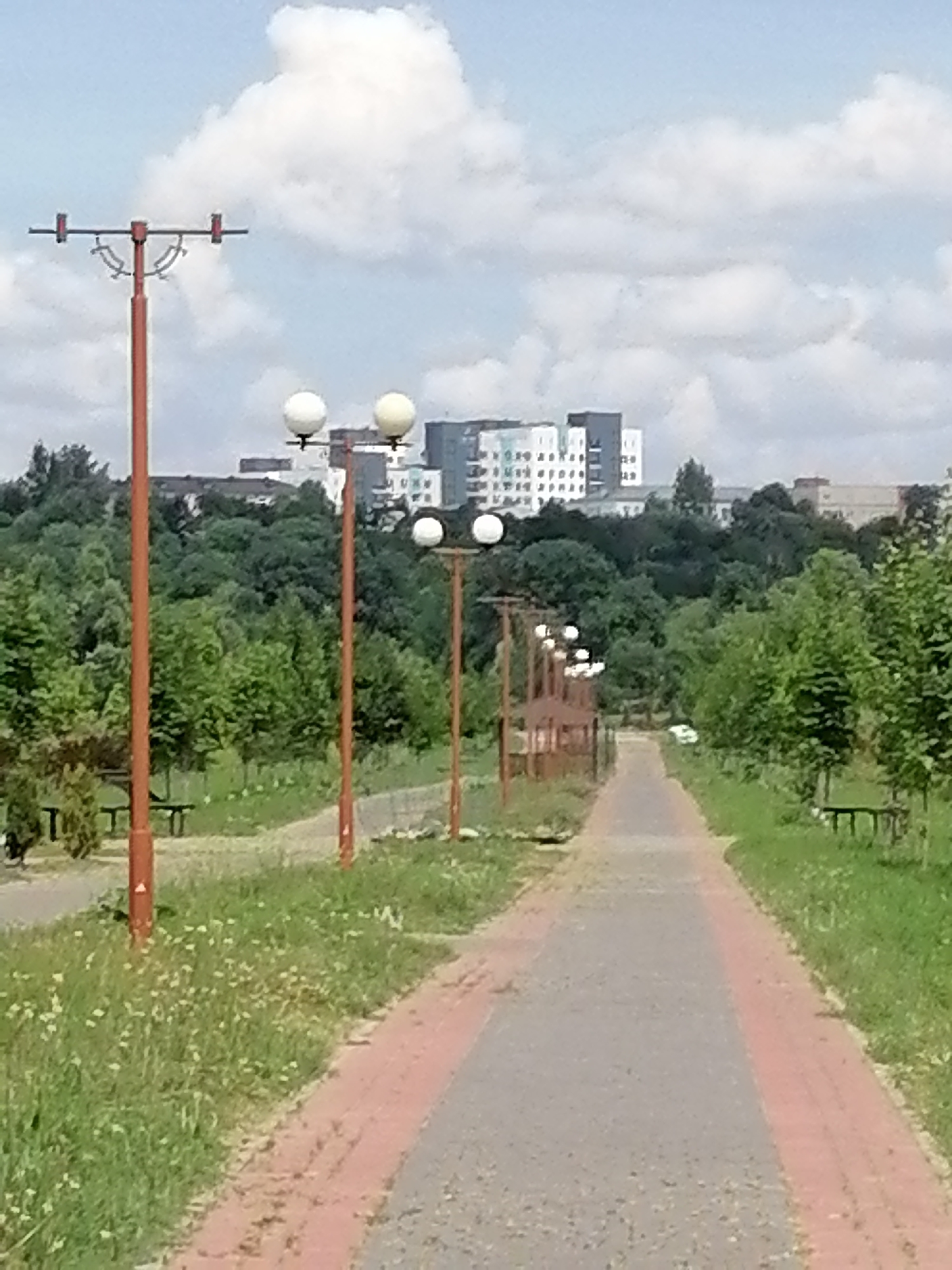 Strolling a Russian civic park with churches, sculptures, and riverside views