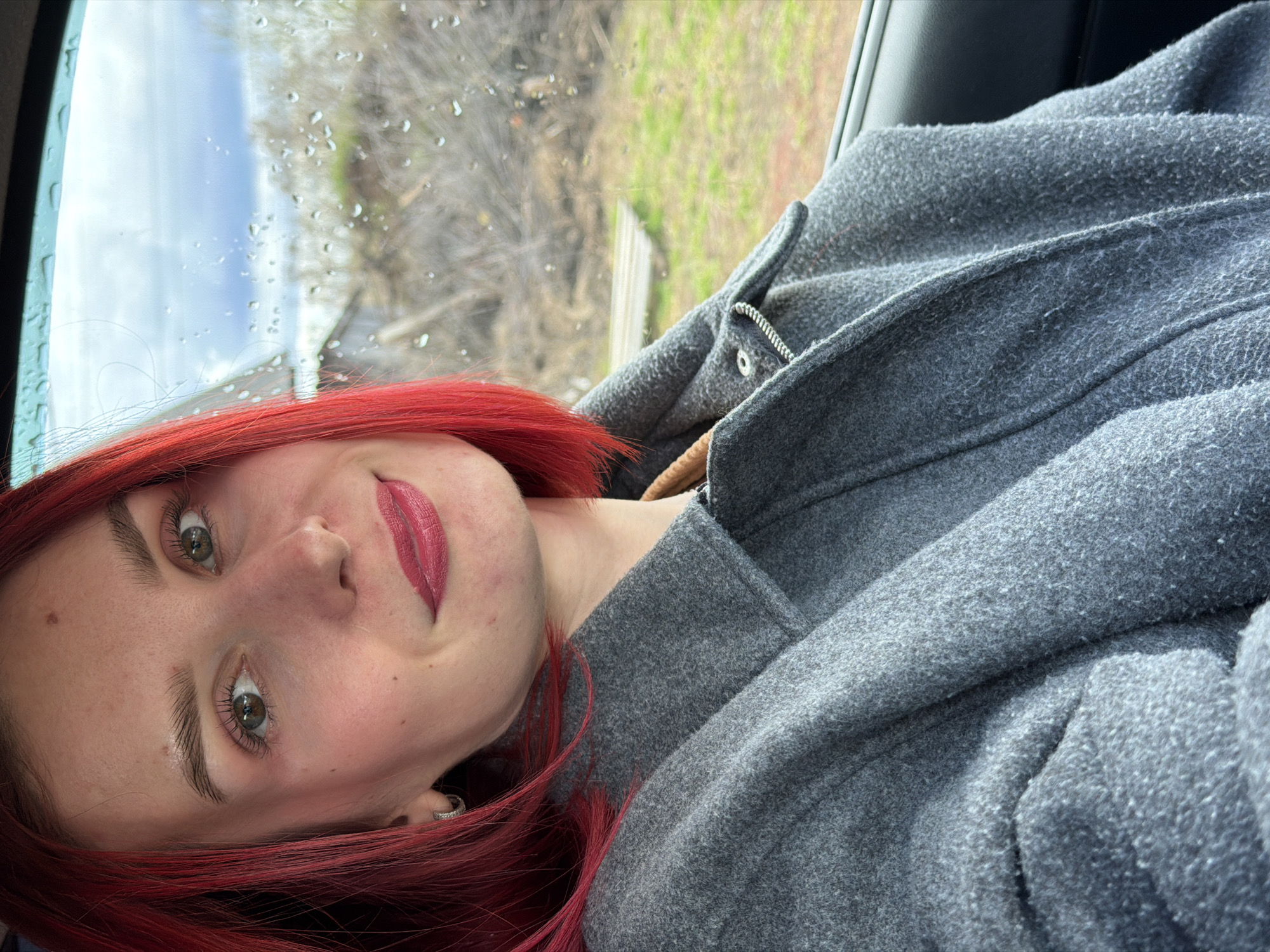 Red-haired woman photographed in casual moments in Chaikovsky