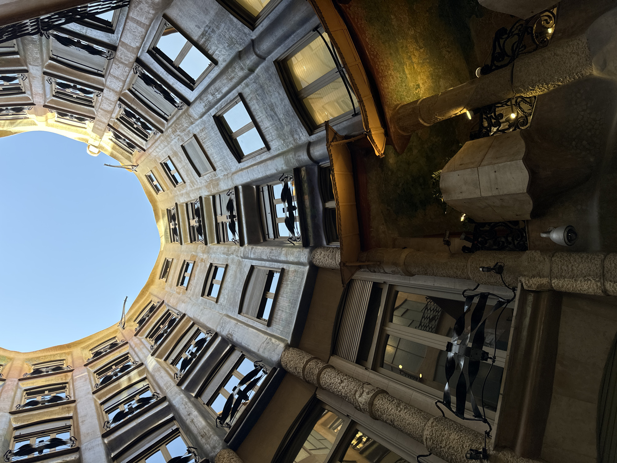 Tourist documents Casa Batlló interior rooms during Barcelona visit