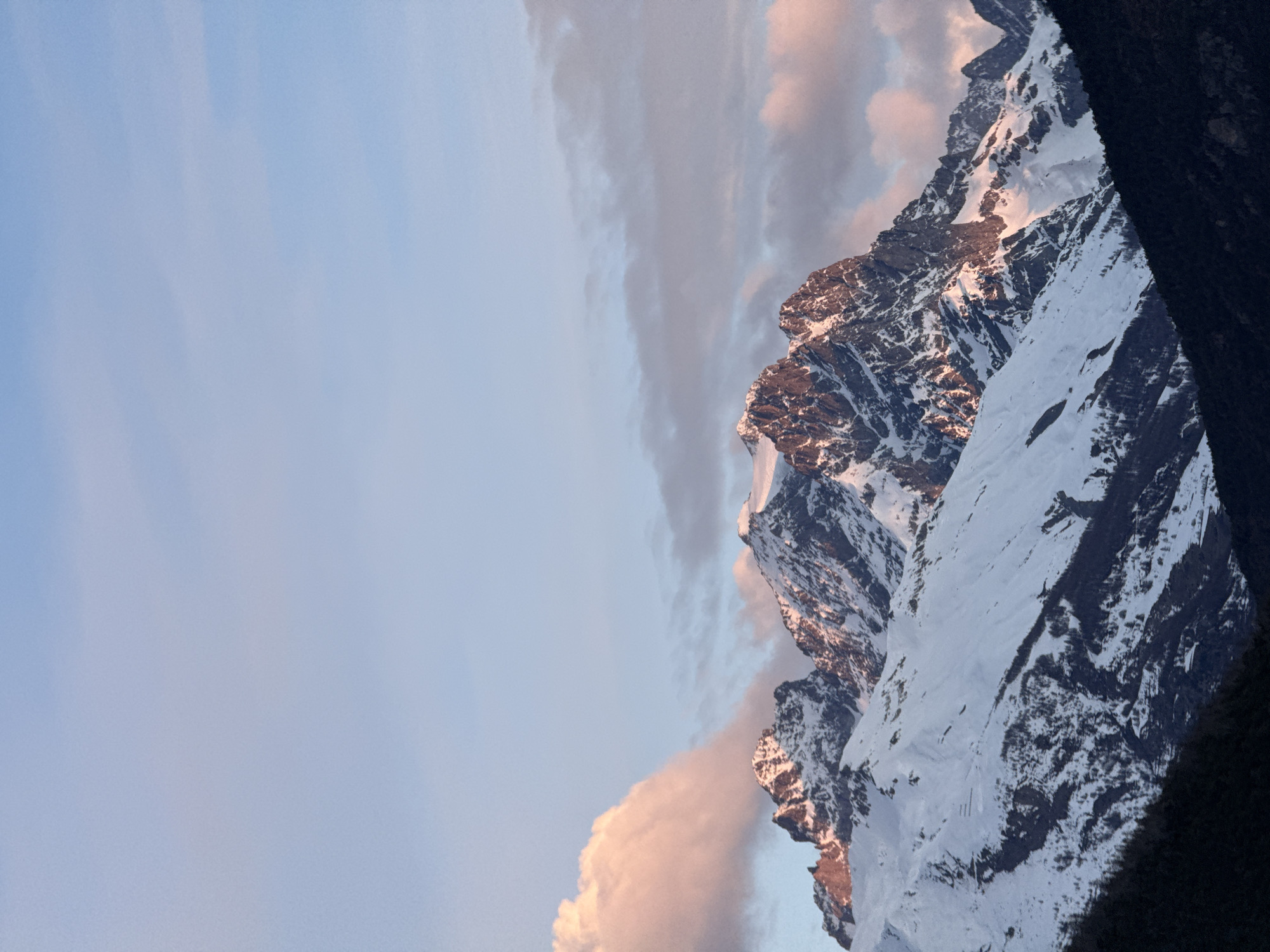 Sunset illuminates snow-capped mountains in French Alps