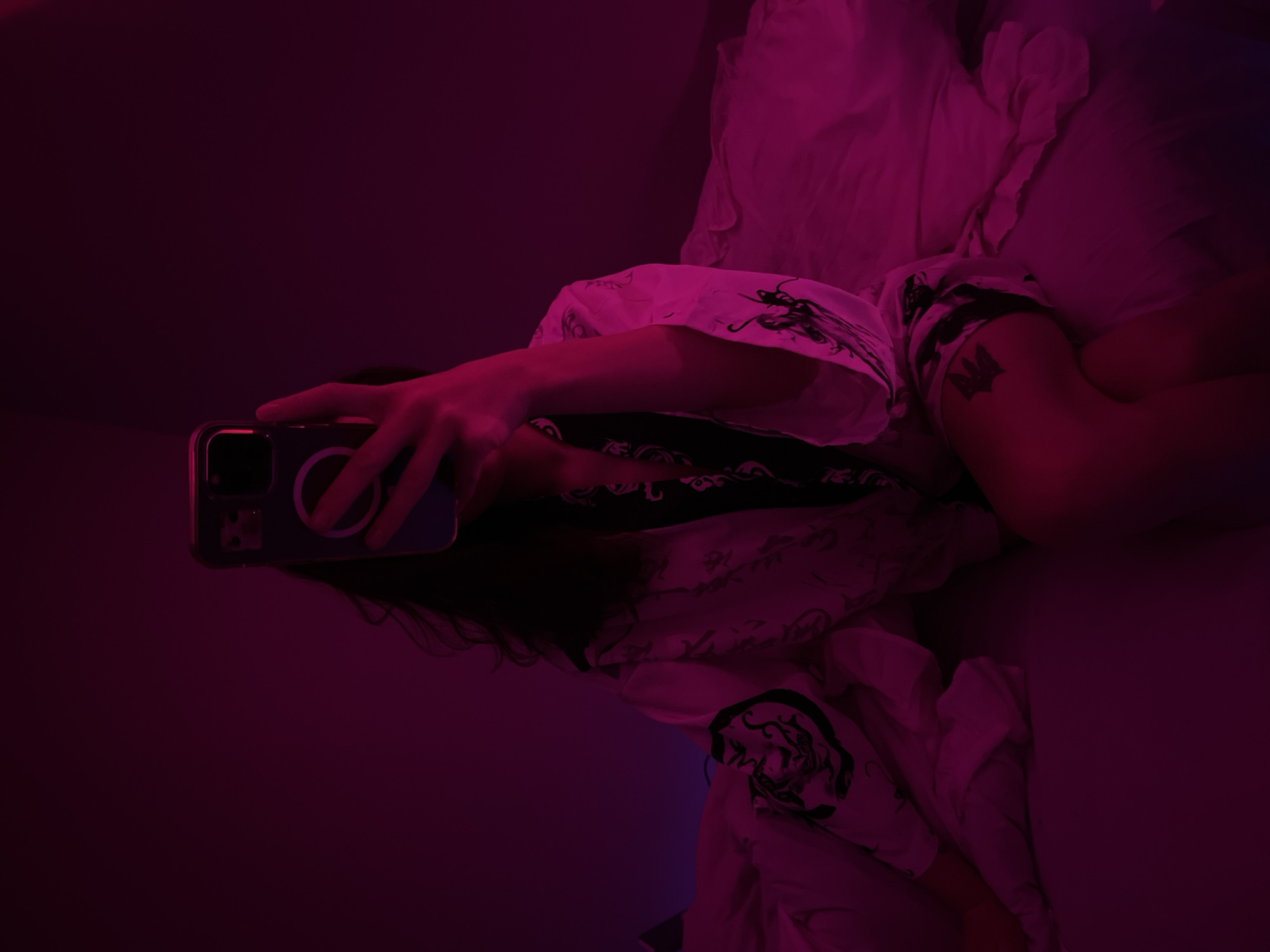 Bedroom selfie session under pink neon lights, Ternopil
