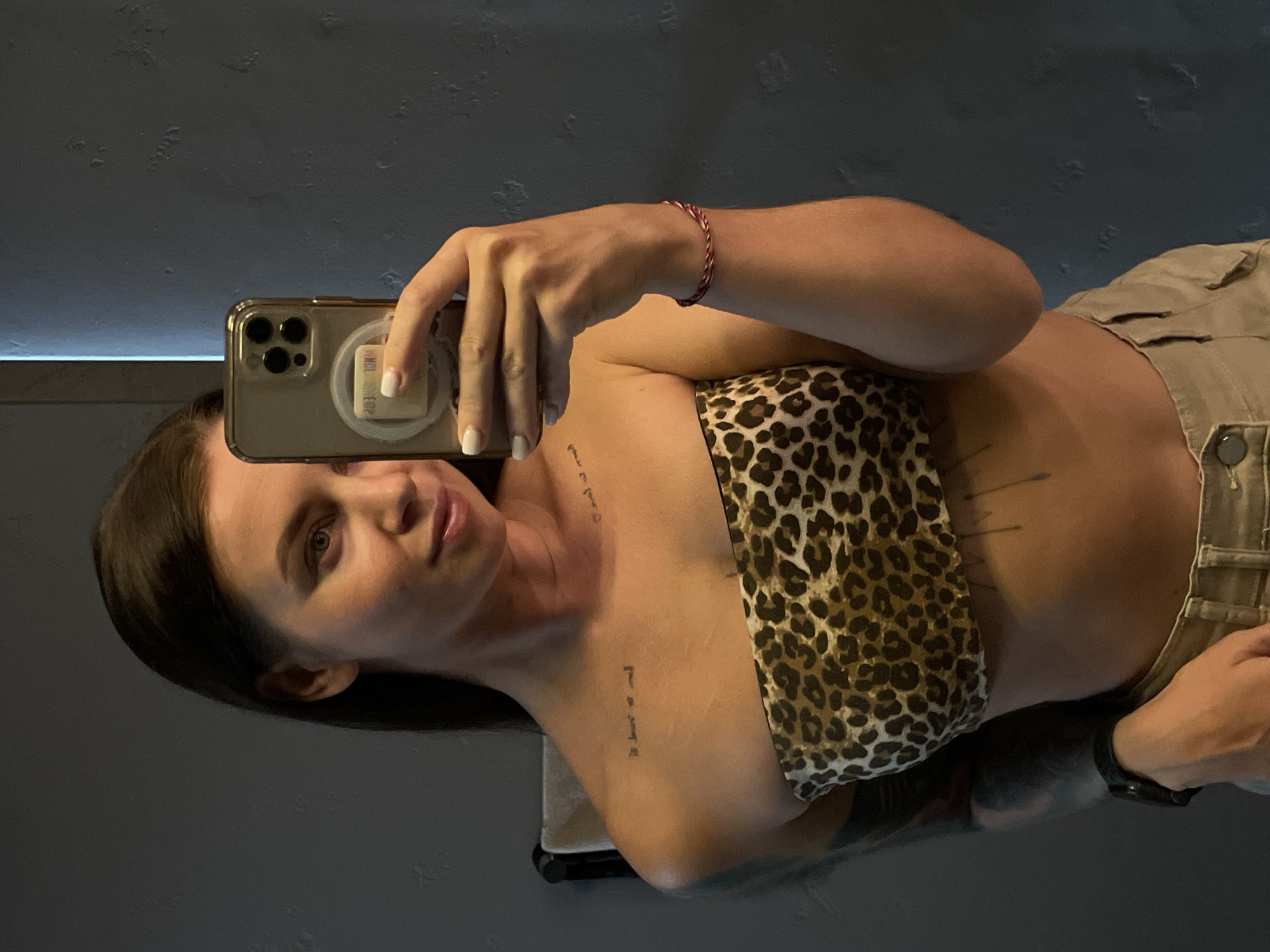 Bathroom mirror selfie, leopard print and tattoos, Kediri