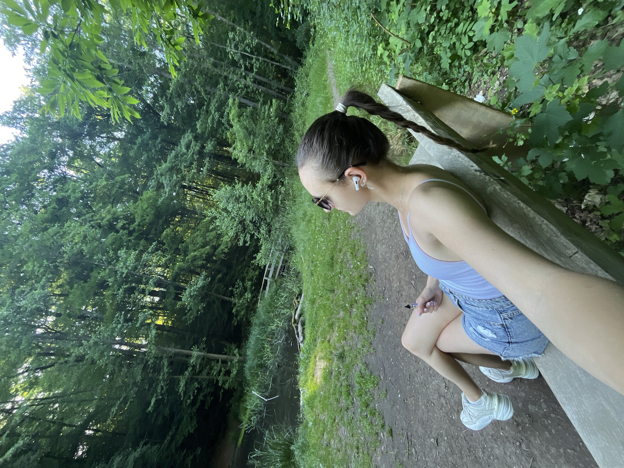 Woman enjoys leisurely afternoon at Saarbrücken waterside park